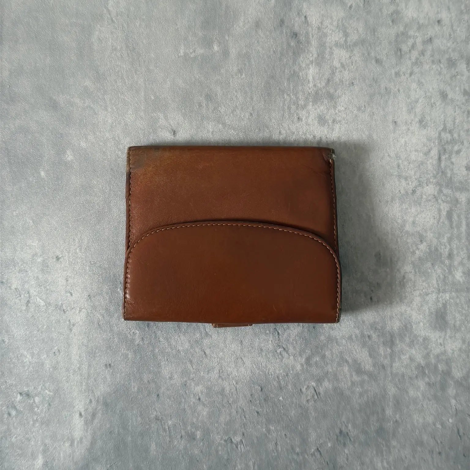 Gucci Signature Logo Clip Vintage Brown Wallet, crafted from smooth brown leather with a gold-tone logo clip.