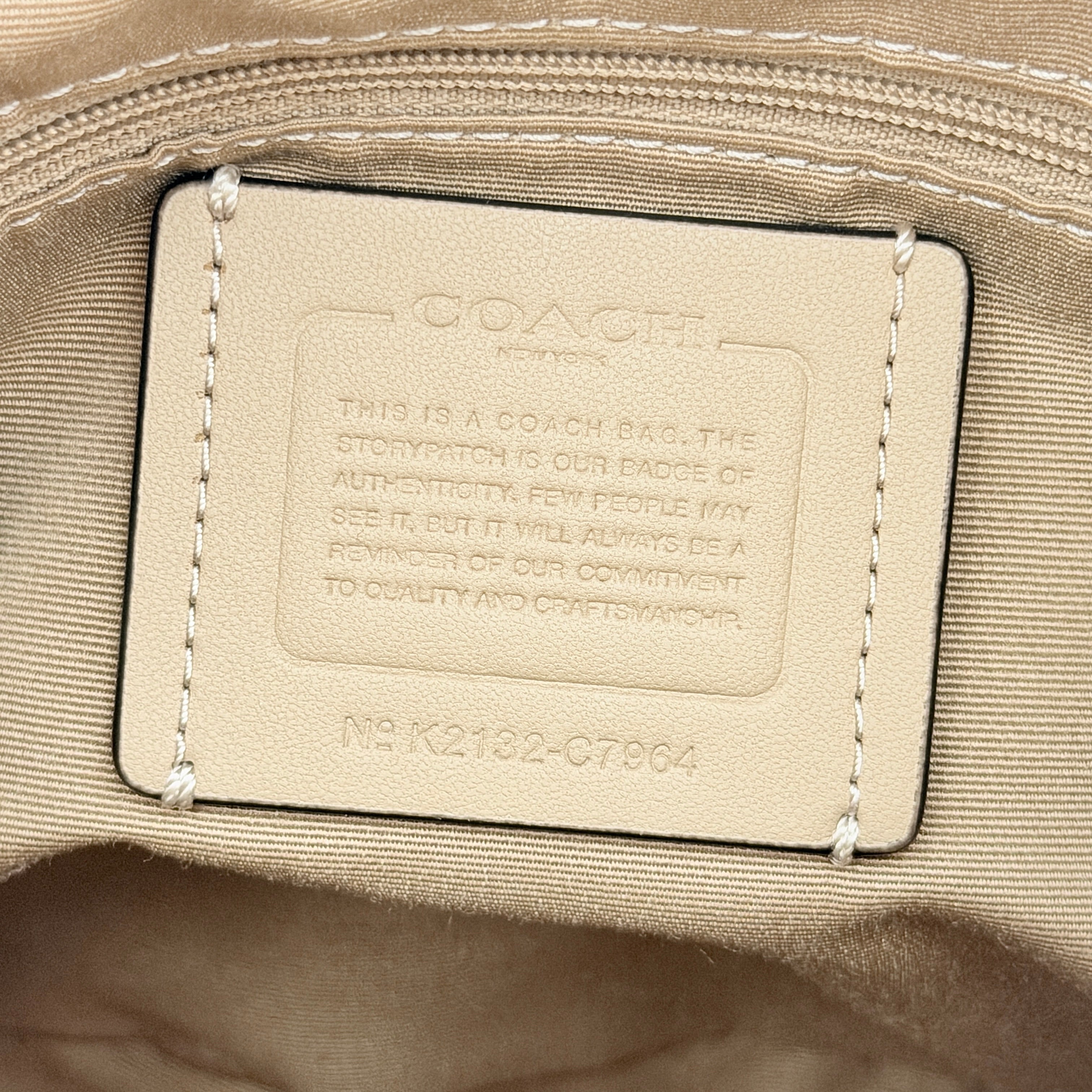 Coach Signature Dempsey 19 bucket bag in pink and white canvas with white leather trim and detachable strap.