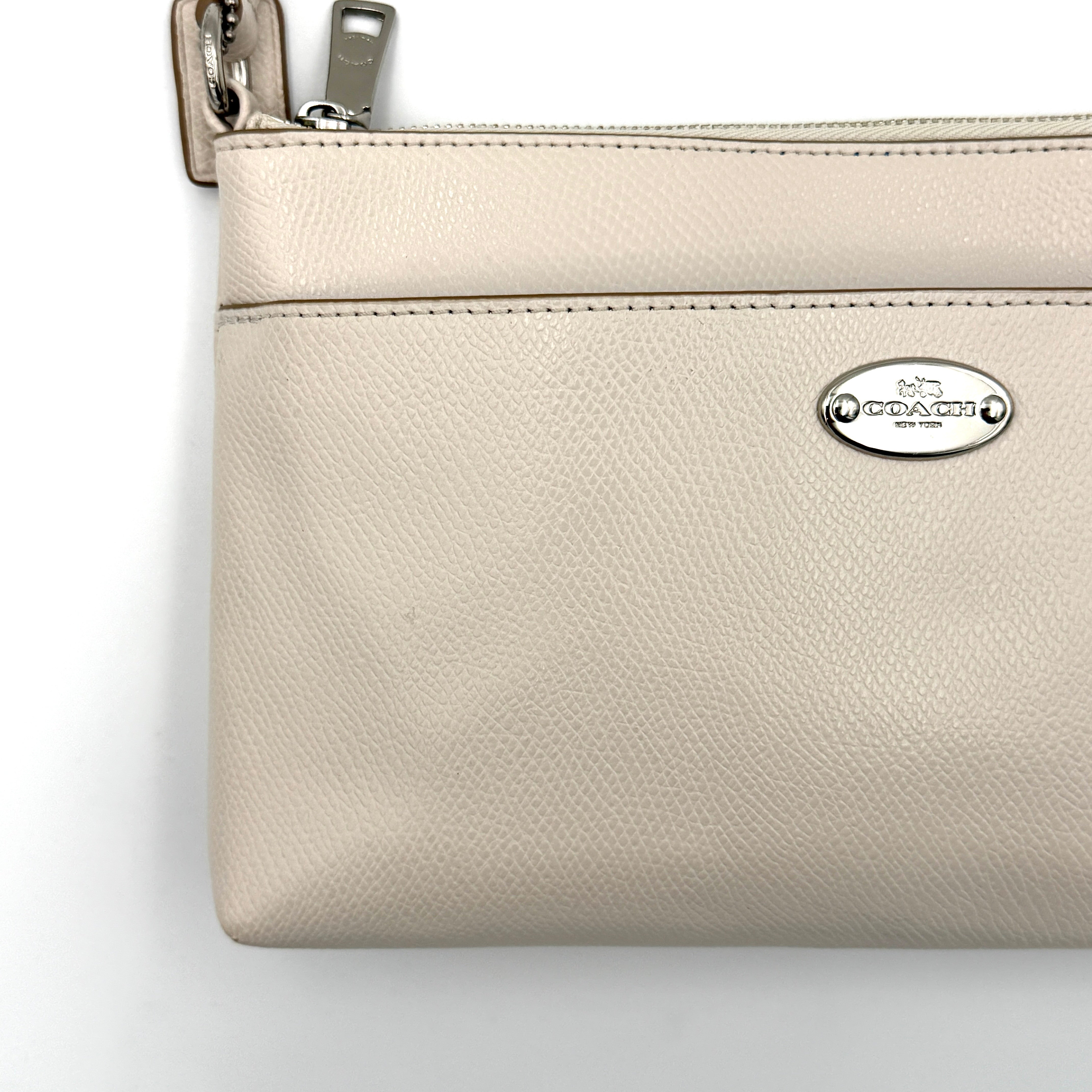 Coach 2in1 Floral Pop Pouch Shoulder Bag in ivory leather with detachable top handle and silver hardware, featuring a navy floral printed insert.