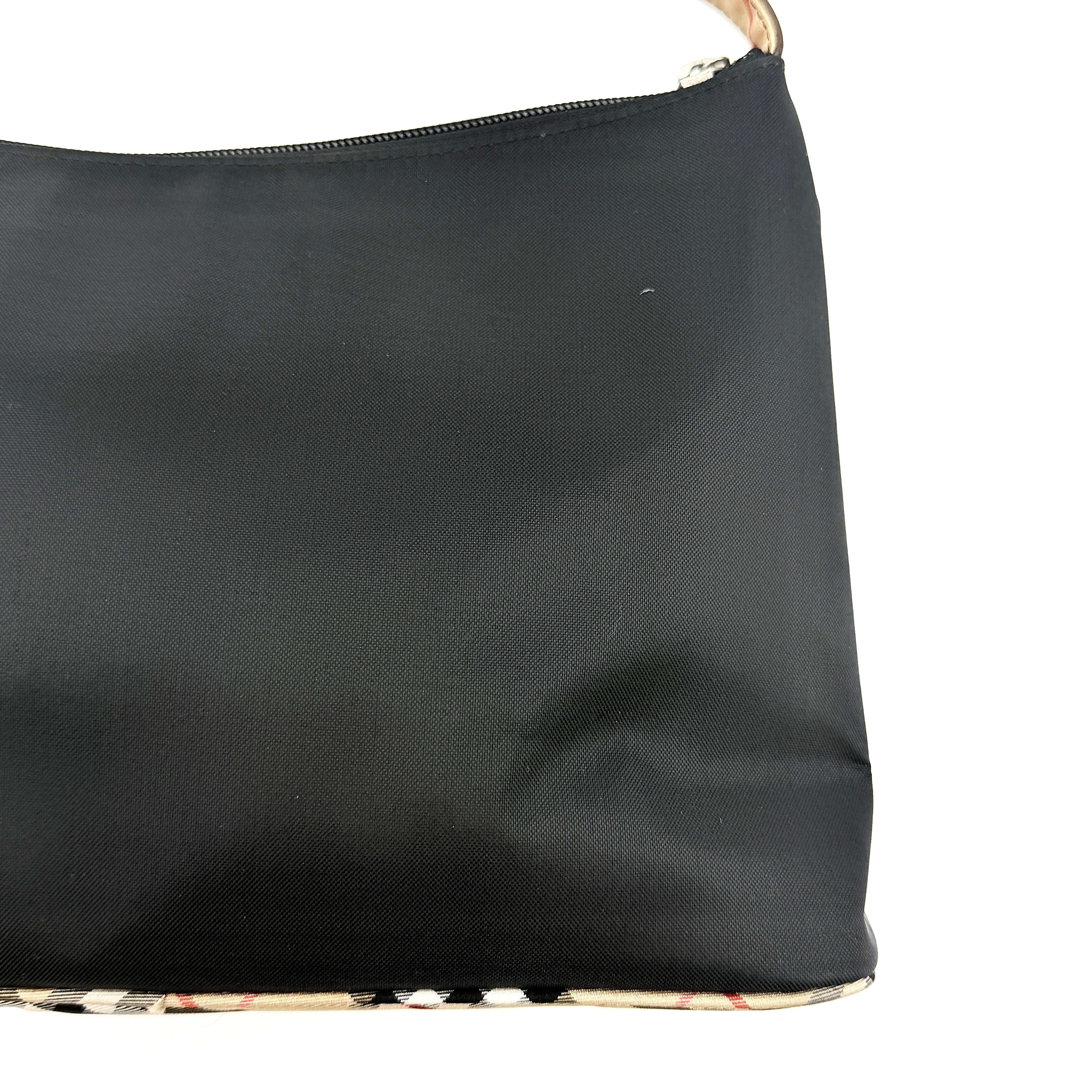 Front-facing Burberry Nova Check Nylon Shoulder Bag in black with Nova Check strap and base, shown against a clean background.