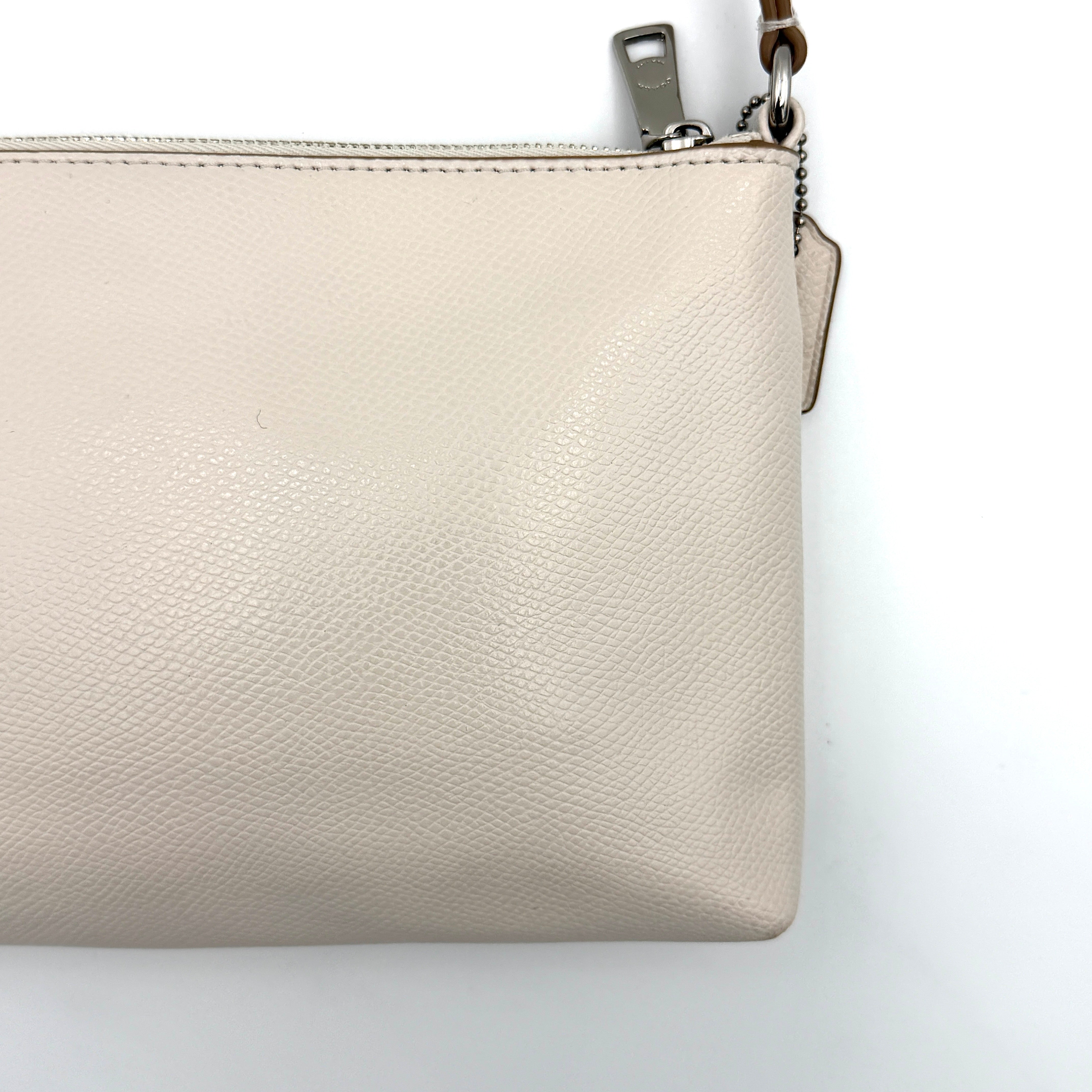 Coach 2in1 Floral Pop Pouch Shoulder Bag in ivory leather with detachable top handle and silver hardware, featuring a navy floral printed insert.