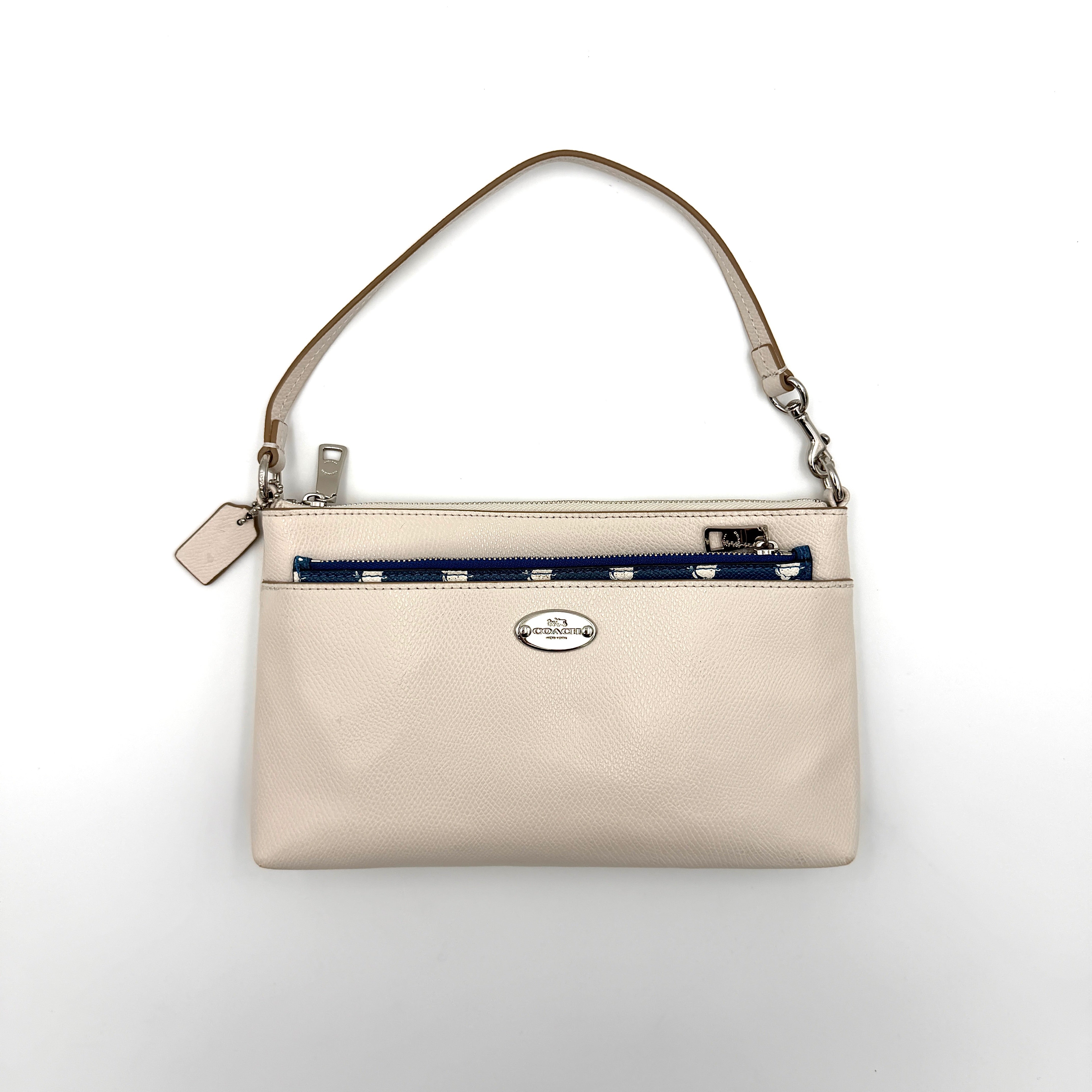 Coach 2in1 Floral Pop Pouch Shoulder Bag in ivory leather with detachable top handle and silver hardware, featuring a navy floral printed insert.