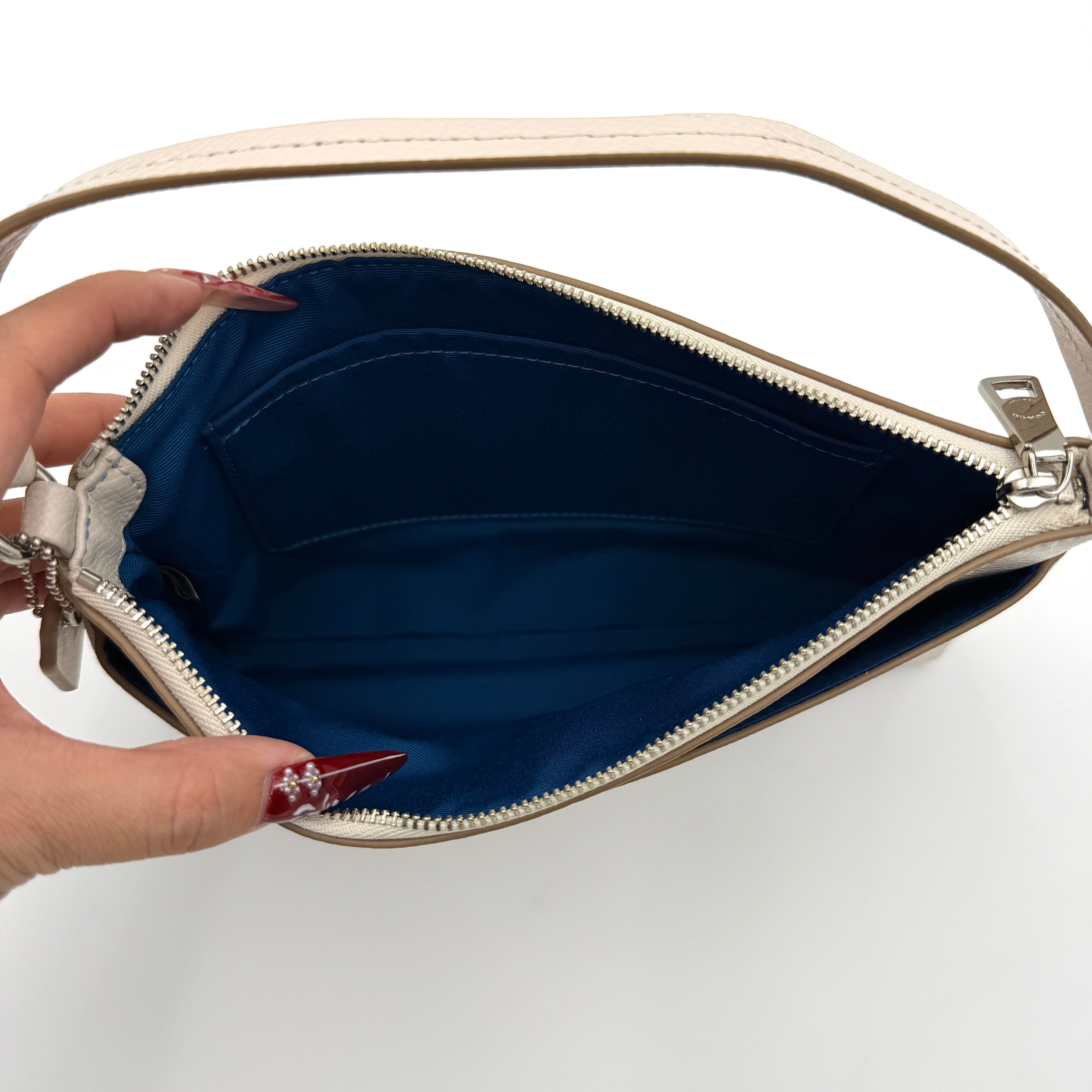 Coach 2in1 Floral Pop Pouch Shoulder Bag in ivory leather with detachable top handle and silver hardware, featuring a navy floral printed insert.