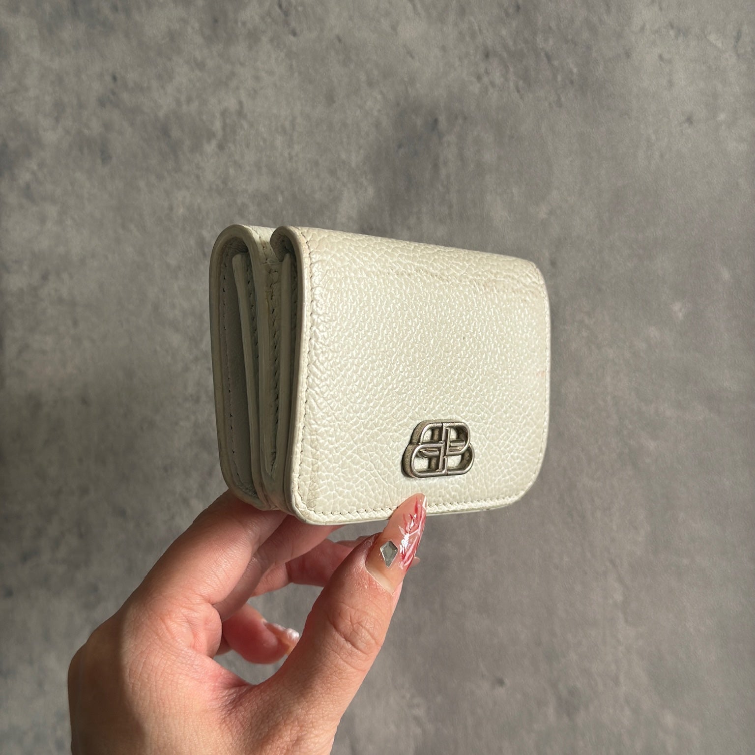 Balenciaga BB Logo Mini Tri-fold White Leather Wallet with silver BB logo, showcasing internal compartments and minimal wear.