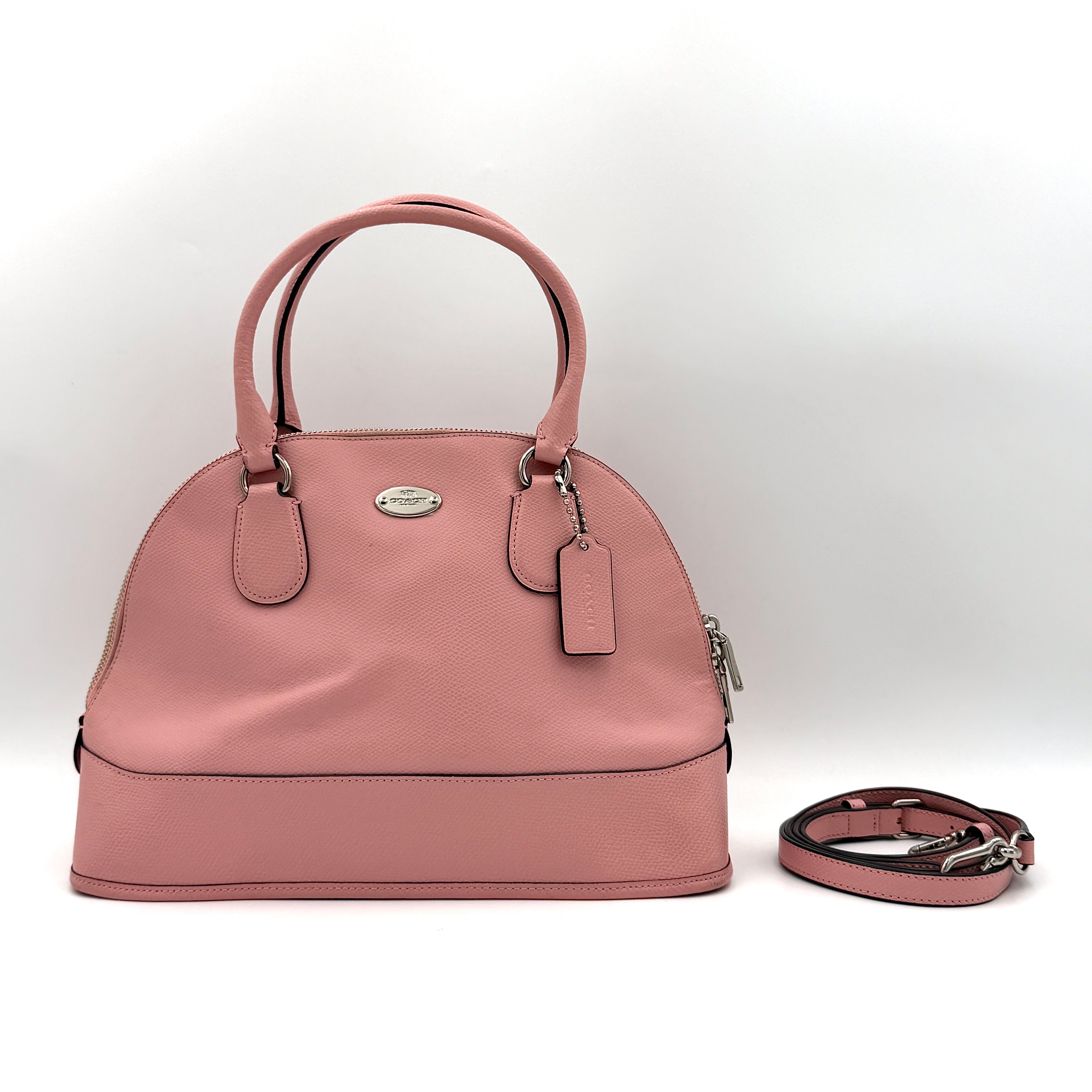 Coach Cora Domed Handbag in light pink leather with silver hardware, styled with double handles and detachable strap.
