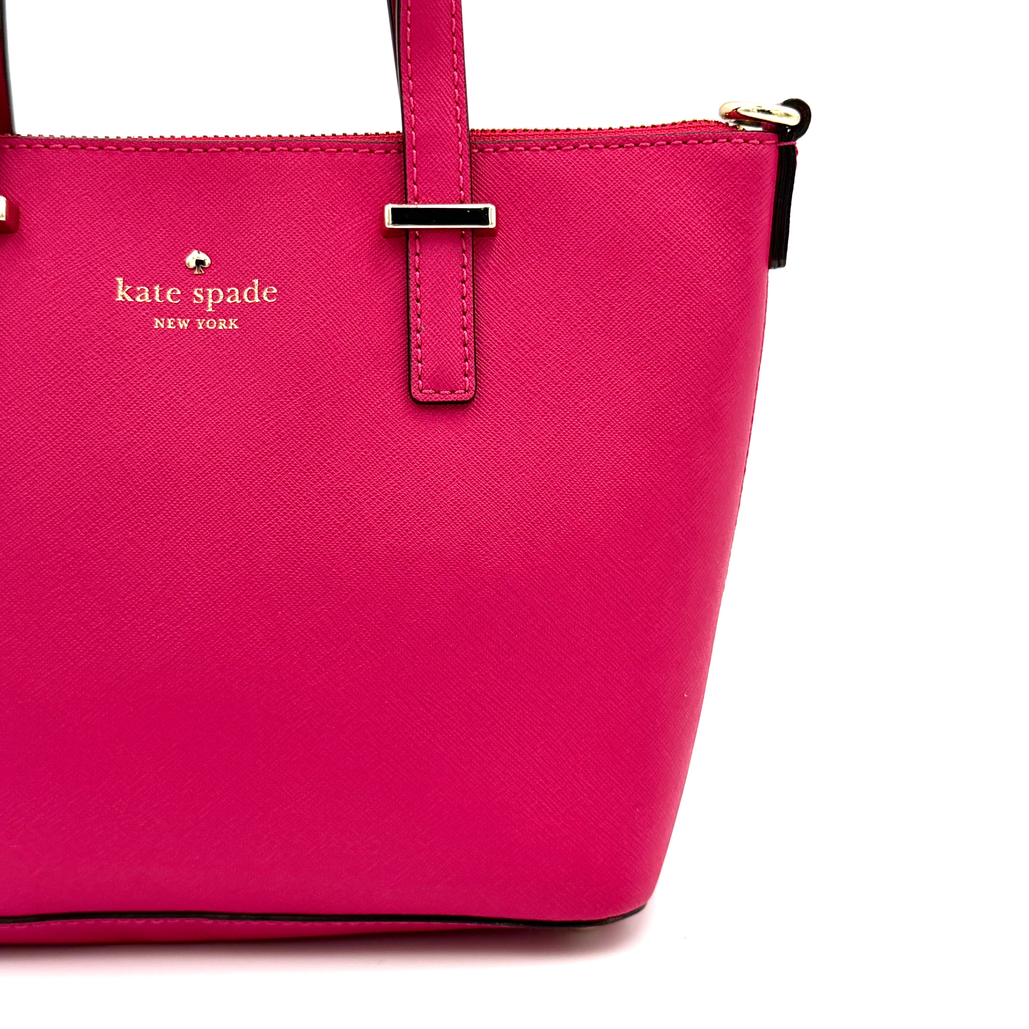 Kate Spade Cedar Street handbag in bold fuchsia pink Saffiano leather, shown with top handles and detachable strap alongside.