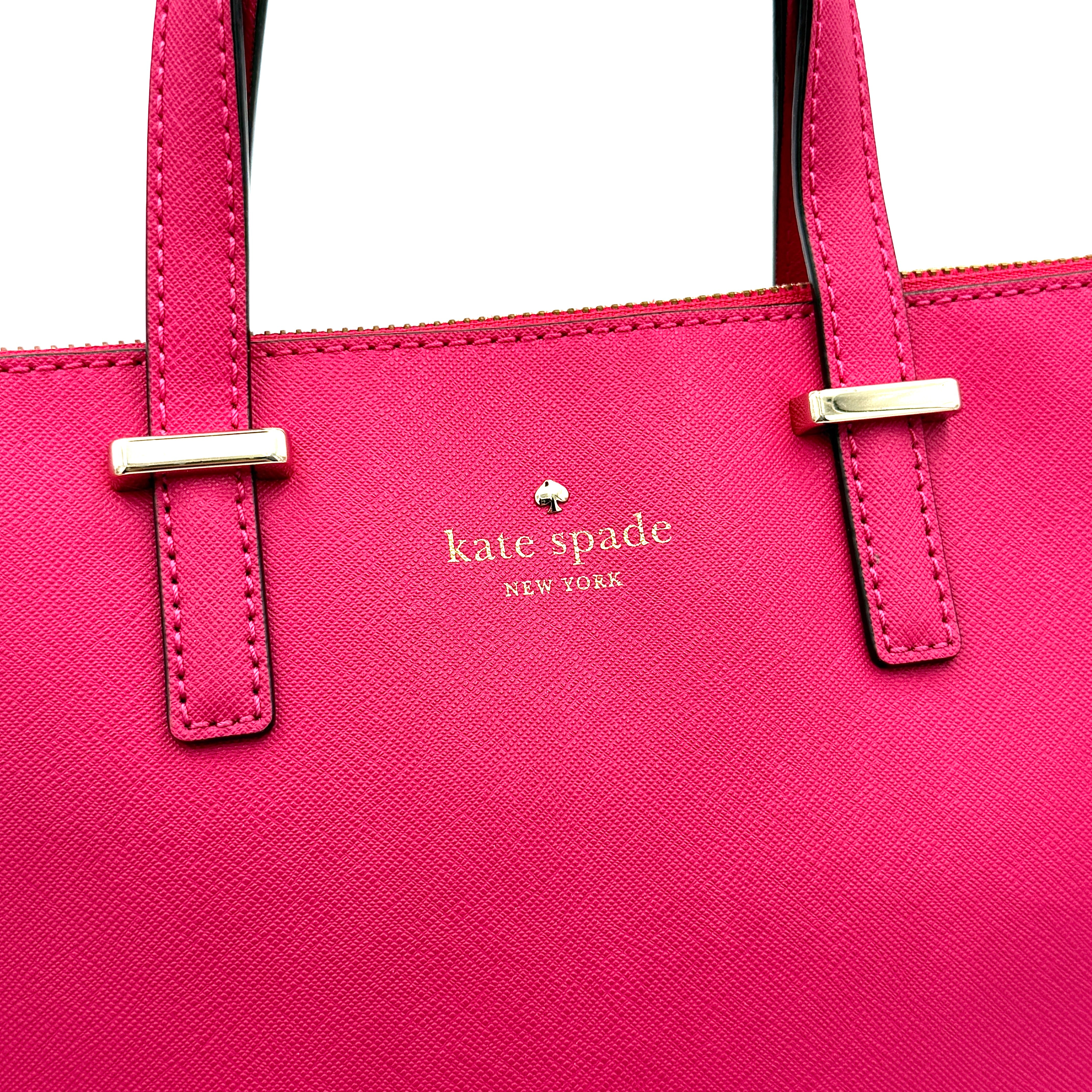Kate Spade Cedar Street handbag in bold fuchsia pink Saffiano leather, shown with top handles and detachable strap alongside.