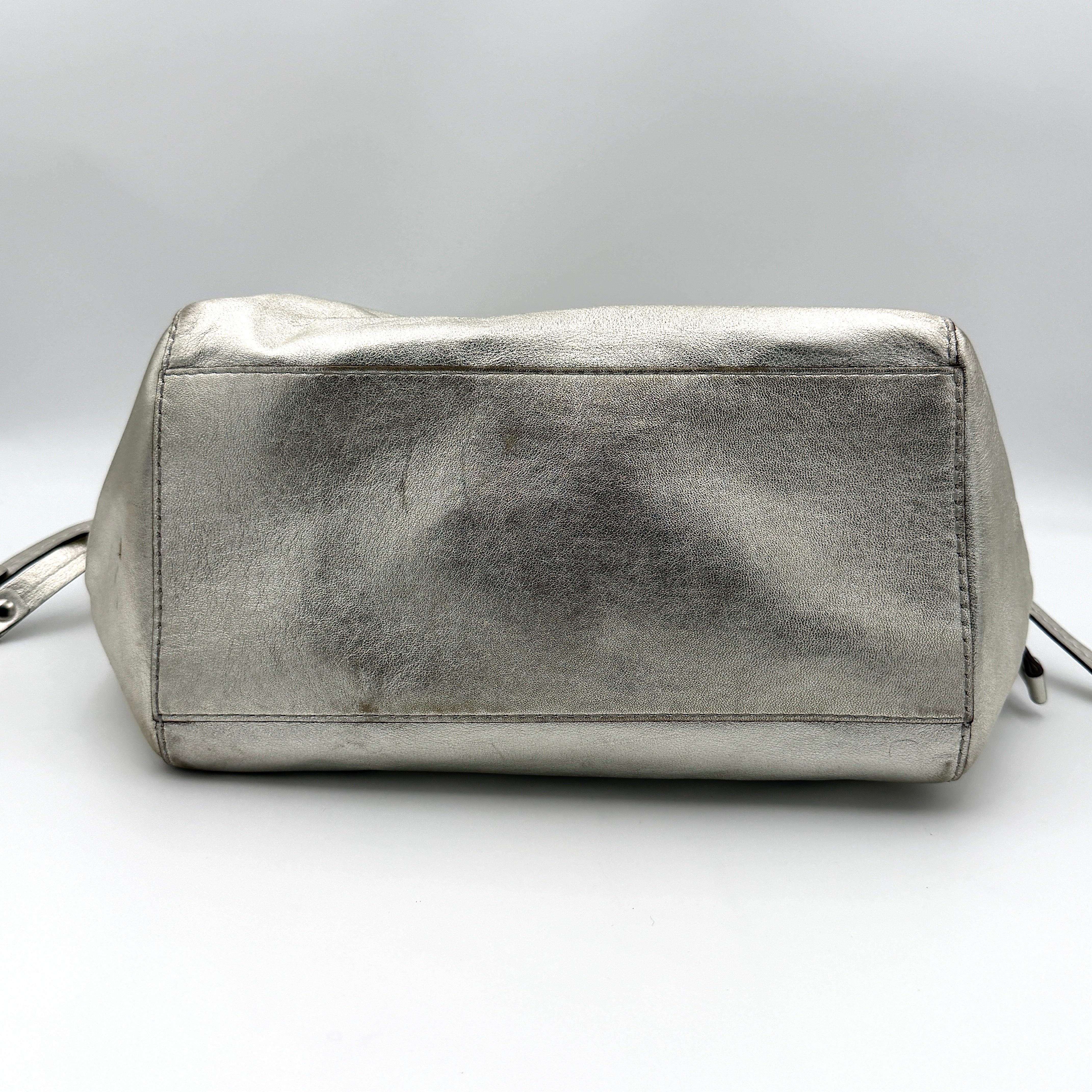 Coach Peyton Metallic Shoulder Bag in shimmering silver leather with dual top handles and polished hardware.