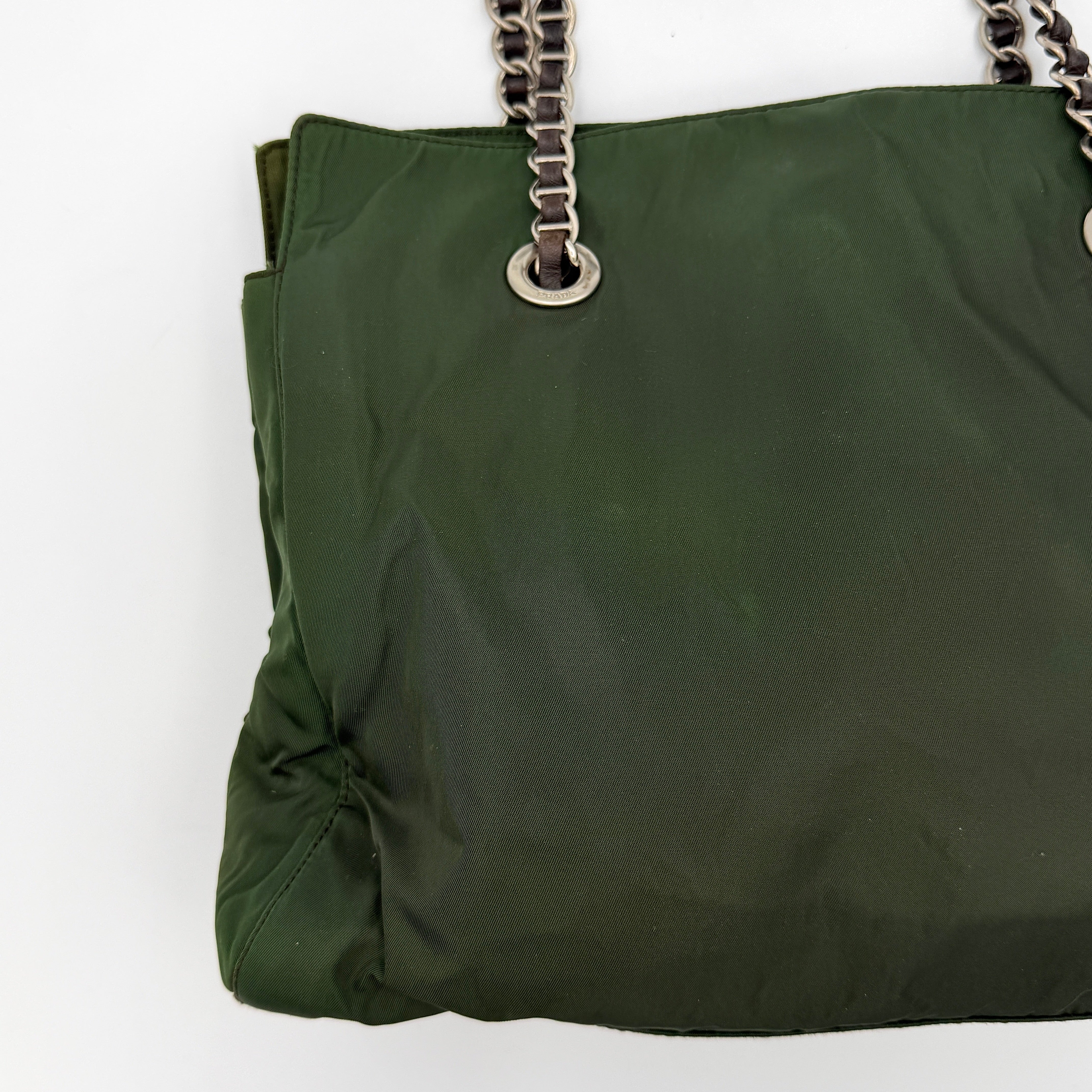 A Prada Tessuto Nylon Chain Shoulder Bag in deep green with silver-tone chain straps, featuring the iconic triangular logo on the front.