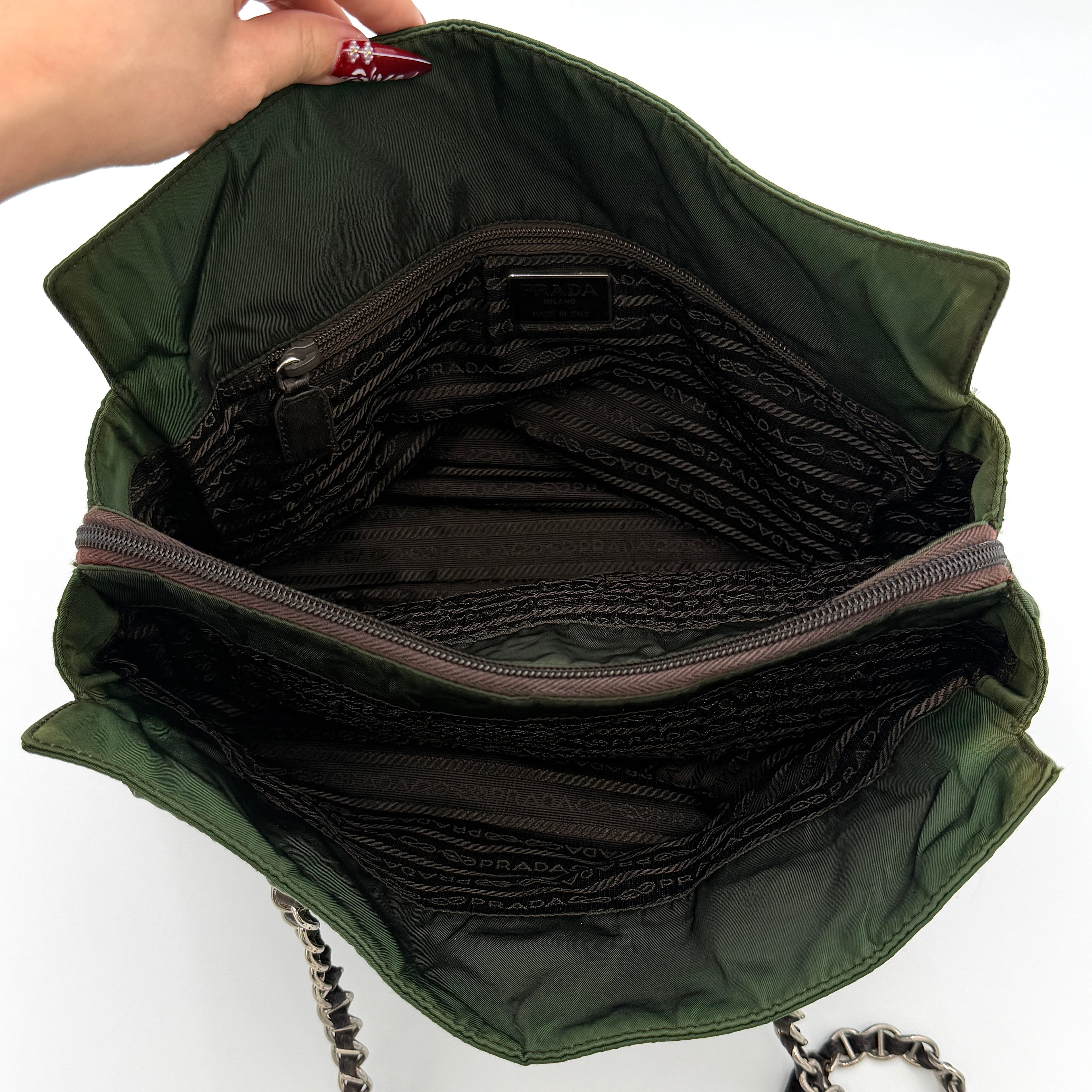 A Prada Tessuto Nylon Chain Shoulder Bag in deep green with silver-tone chain straps, featuring the iconic triangular logo on the front.