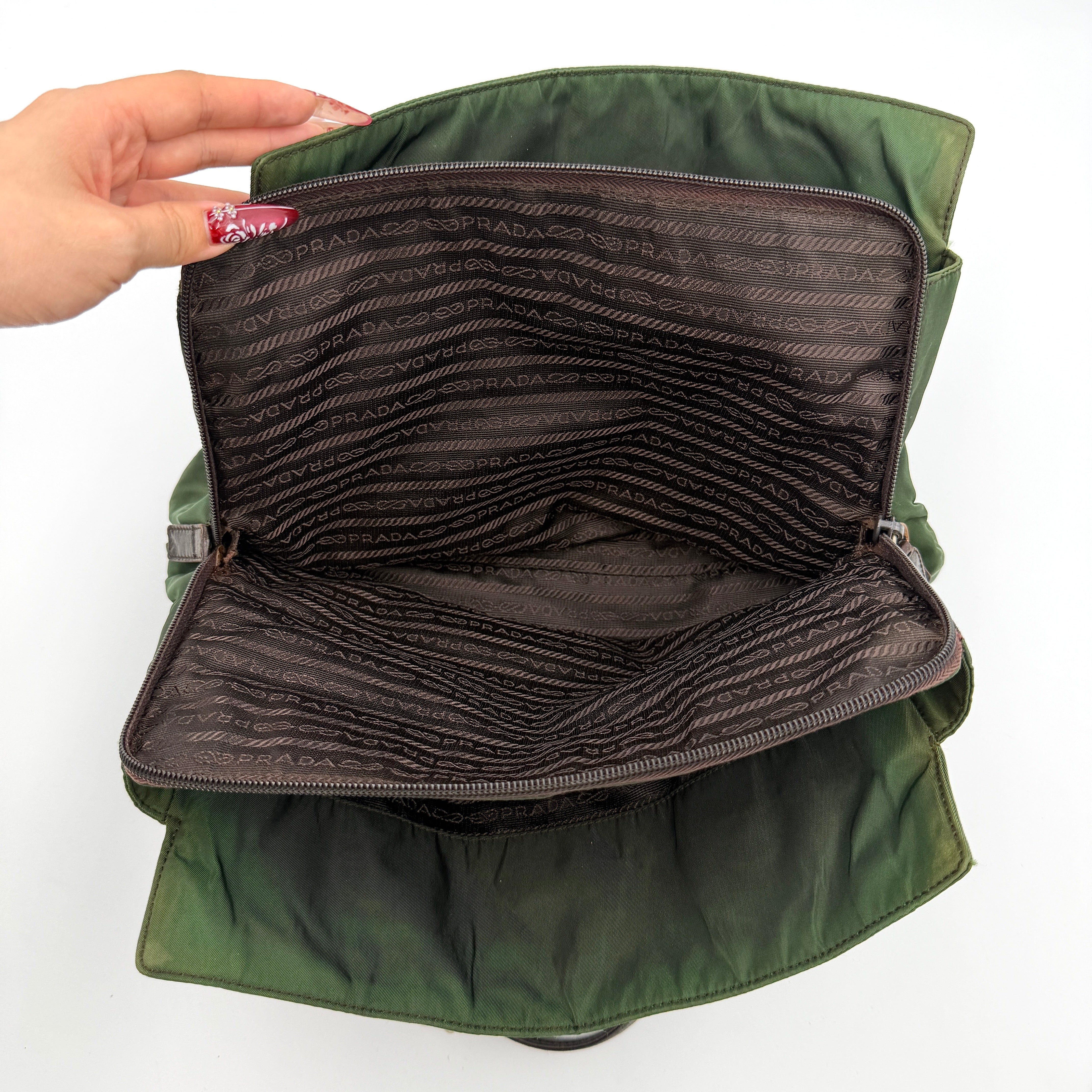 A Prada Tessuto Nylon Chain Shoulder Bag in deep green with silver-tone chain straps, featuring the iconic triangular logo on the front.