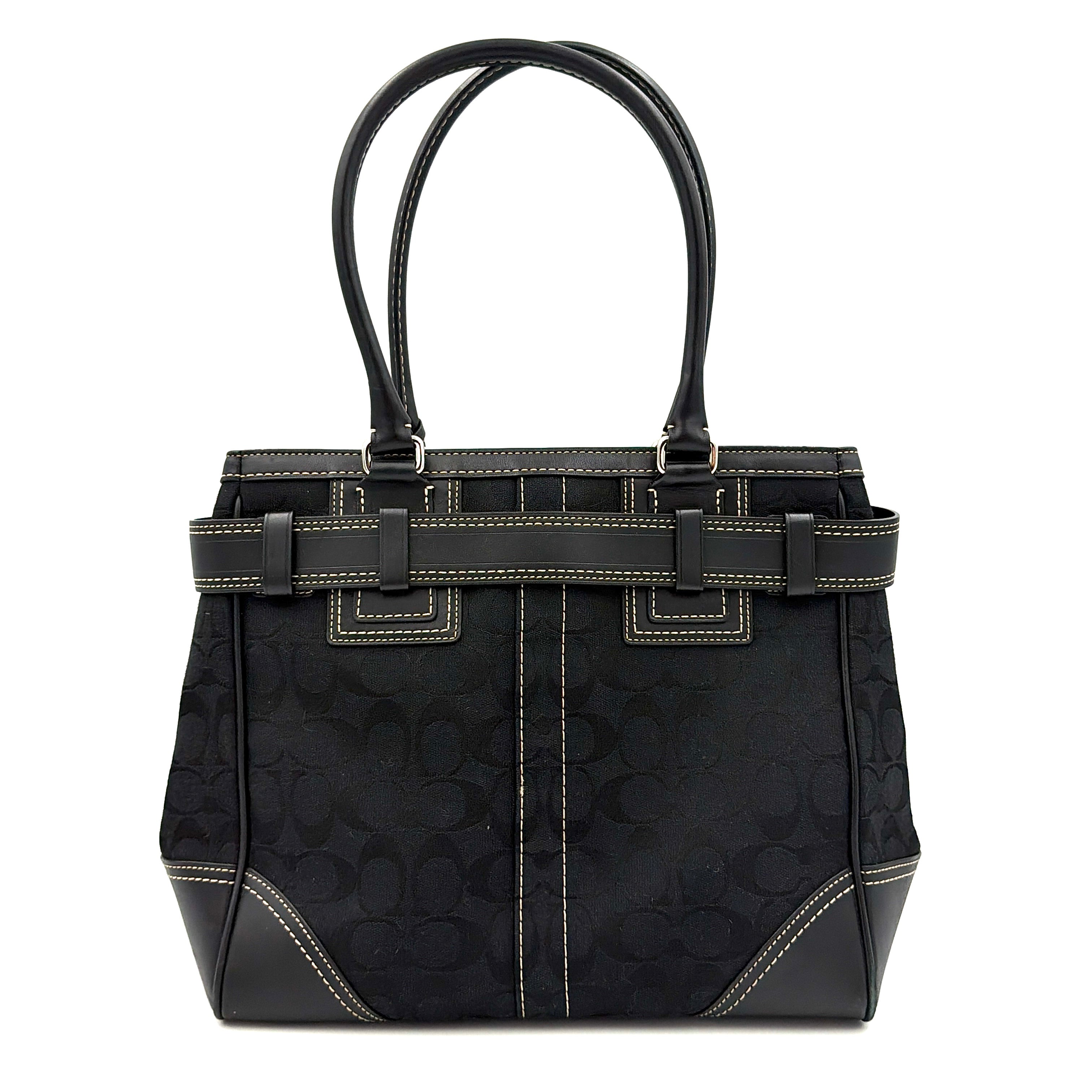 Coach Signature Hampton Carryall in black with monogram jacquard, belted leather trim, and silver-tone horsebit hardware.