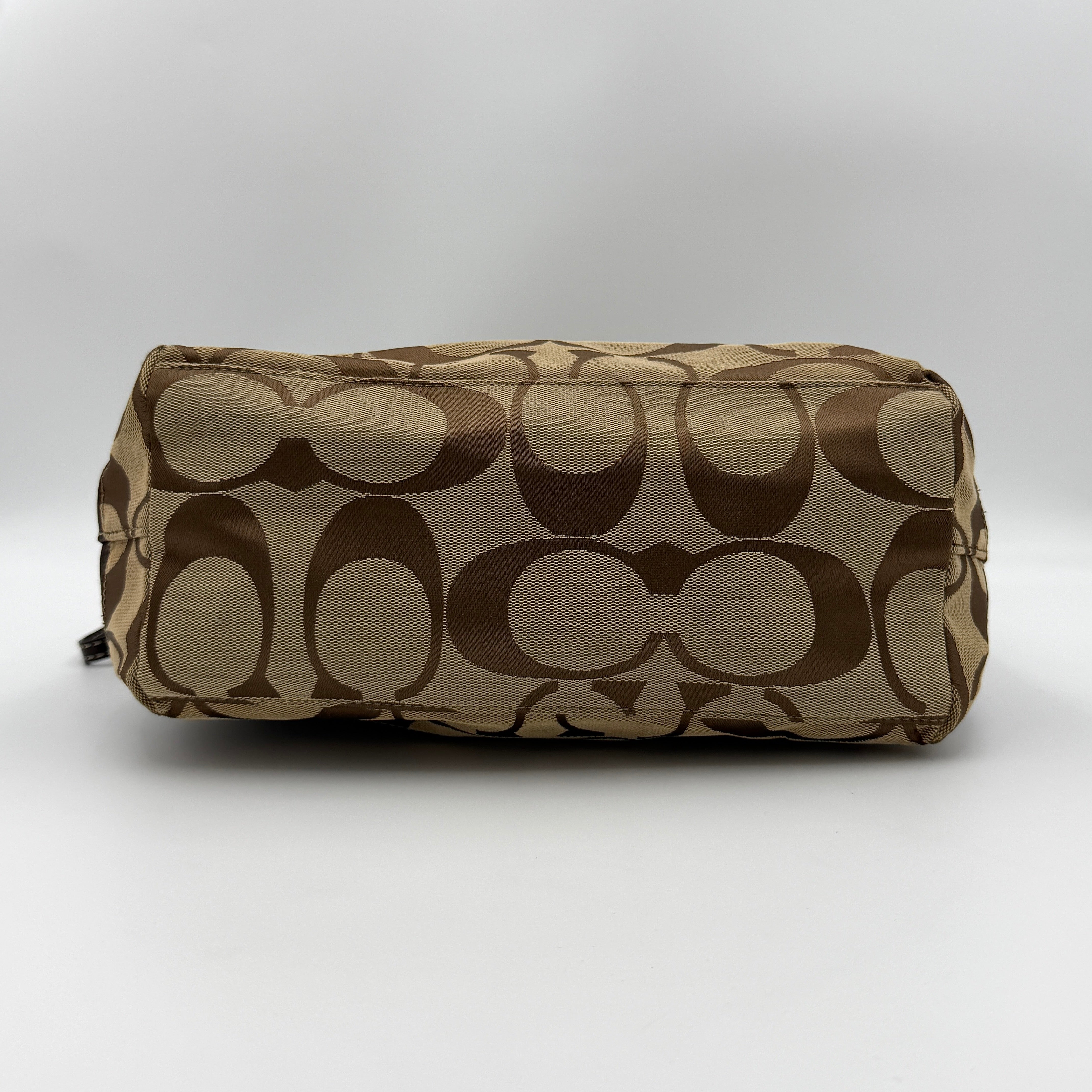 Coach Signature Stripe Tote Bag in brown and beige monogram canvas with chocolate stripe and leather handles, photographed upright.