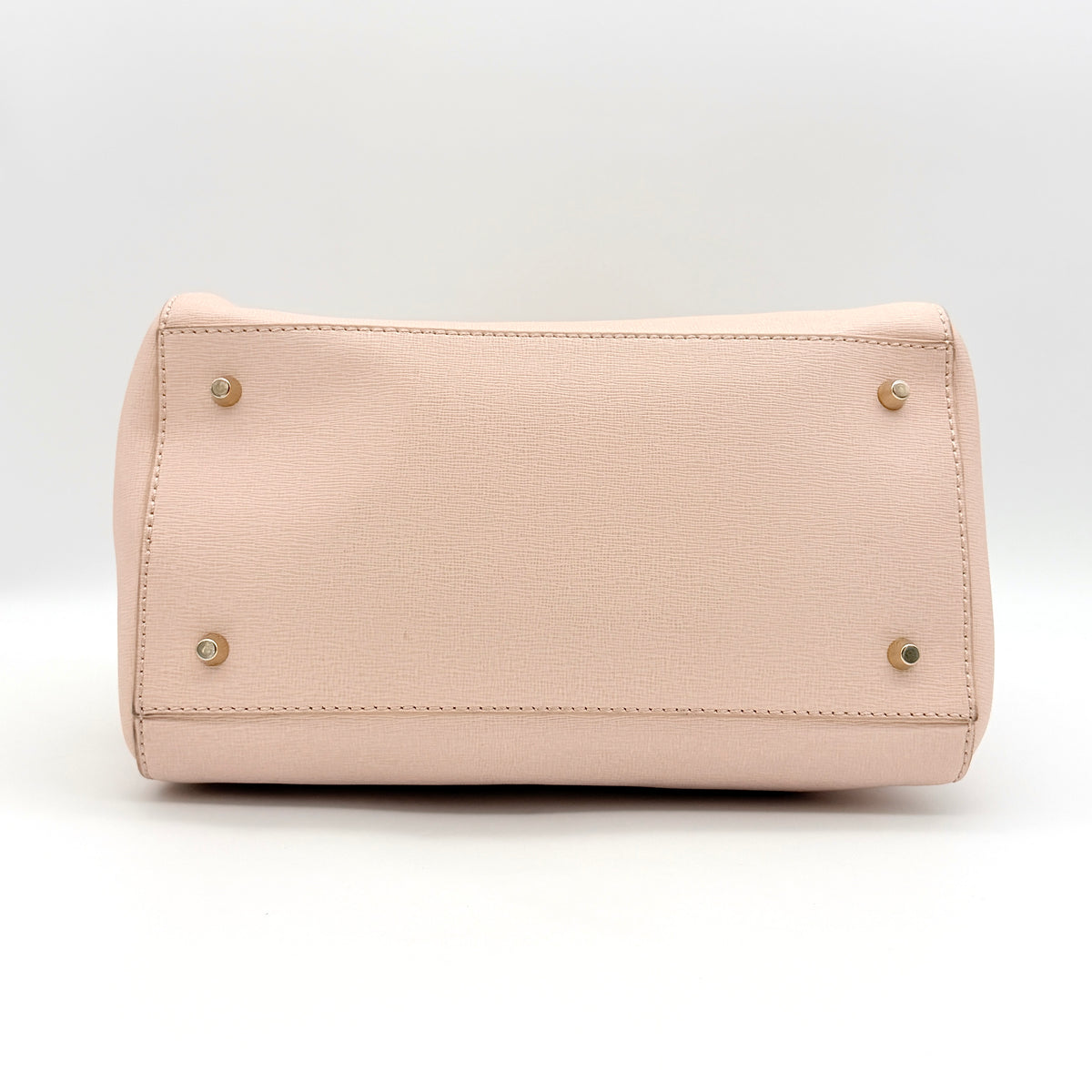 Furla Elena 2Way Saffiano leather satchel in beige with gold-tone hardware and removable strap, displayed on Furla-branded dust bag.