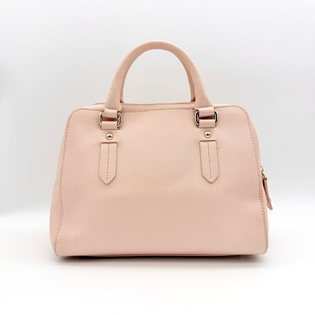 Furla Elena 2Way Saffiano leather satchel in beige with gold-tone hardware and removable strap, displayed on Furla-branded dust bag.