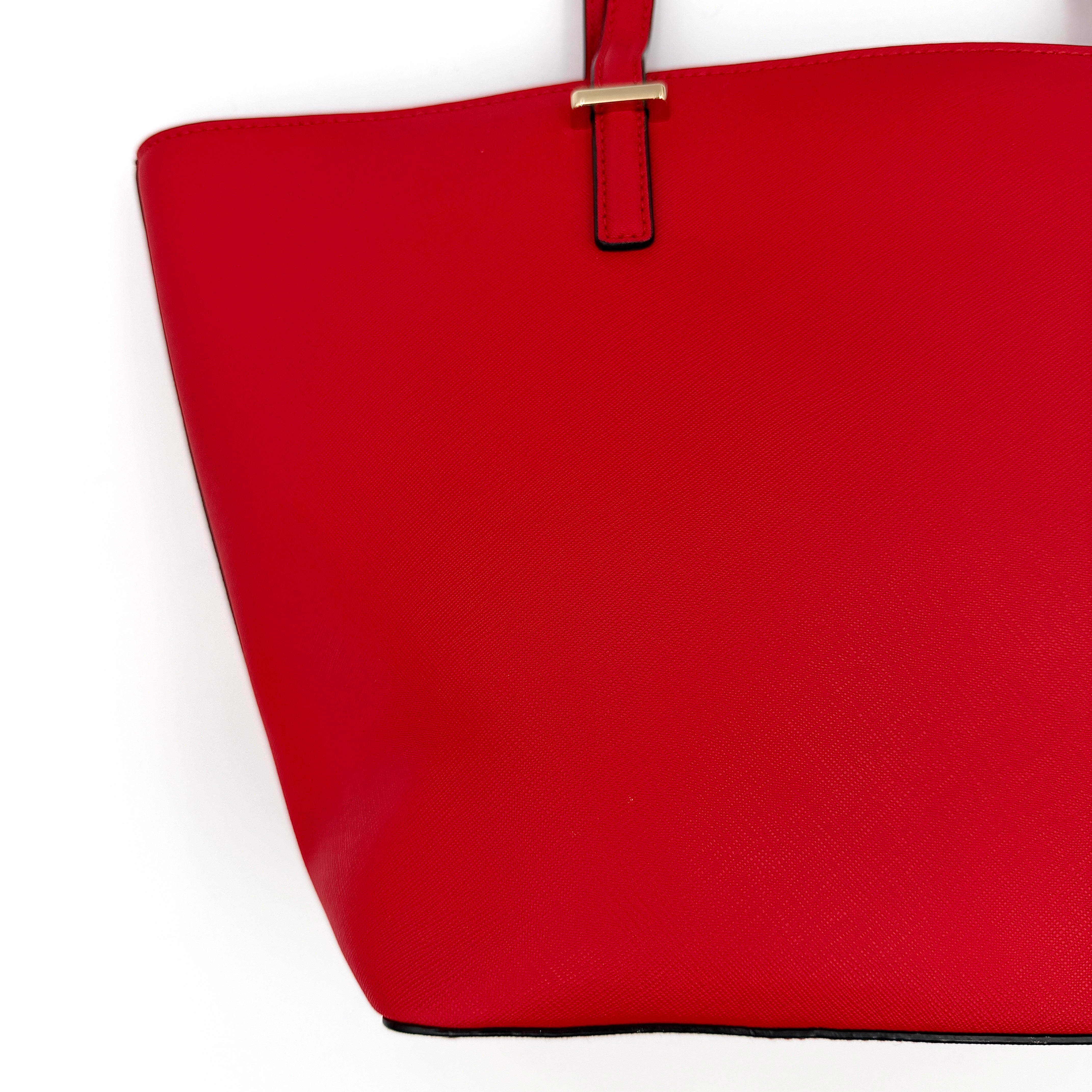 Kate Spade Cedar Street Harmony Tote bag in bold red saffiano leather, featuring dual top handles and gold-tone details.