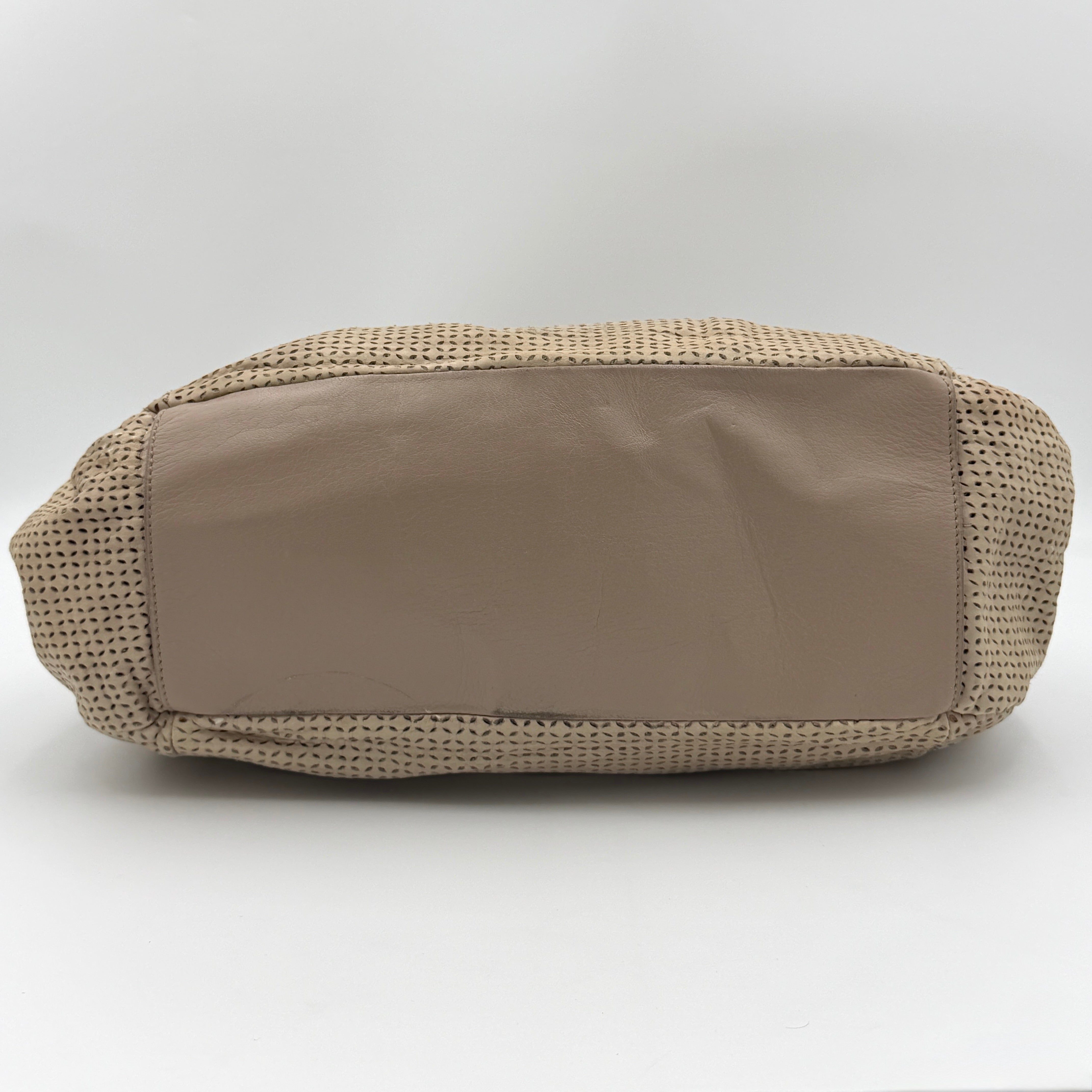 Furla light brown python-embossed hobo bag with perforated leather, silver hardware, and double handles.