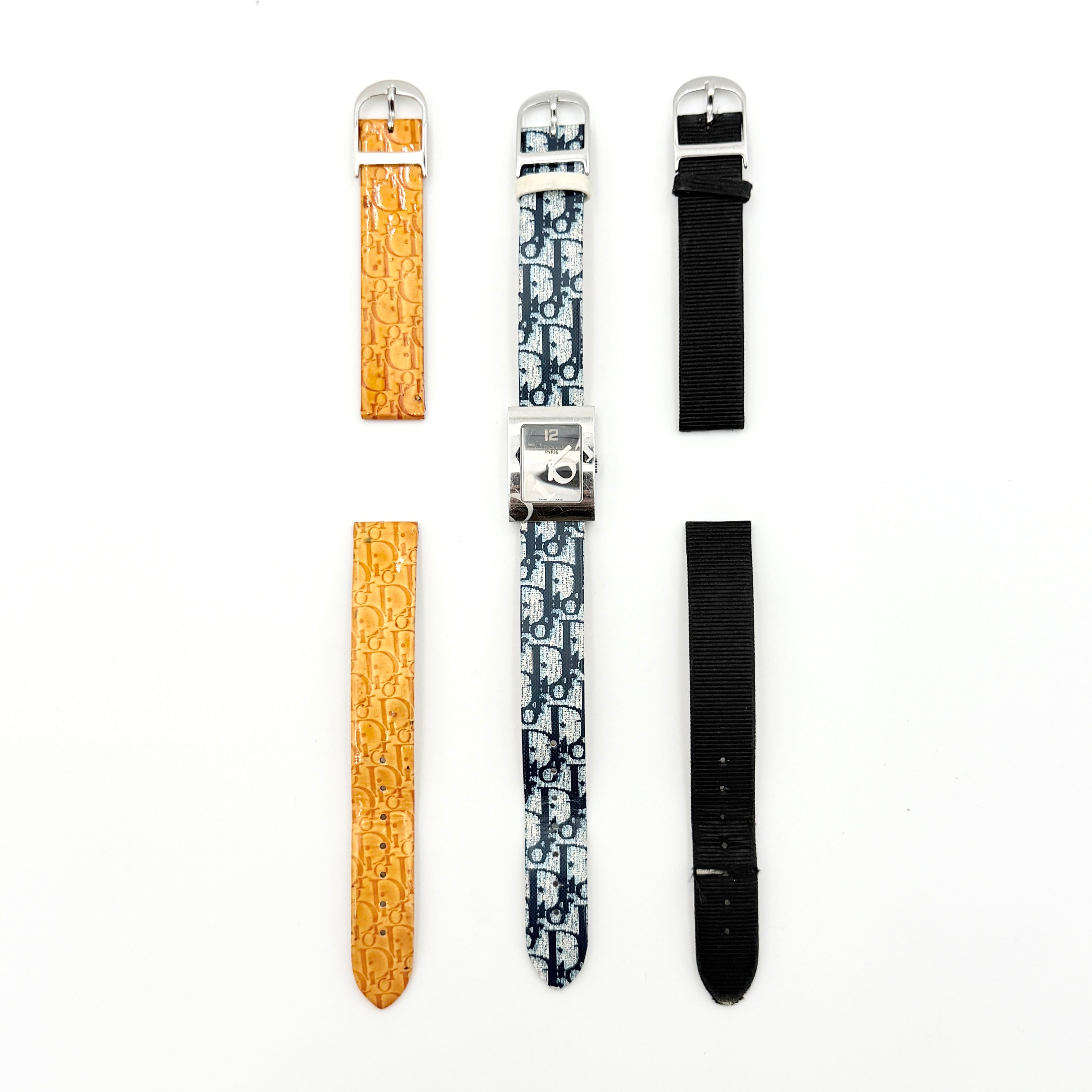 Dior Trotter Malice Watch with blue monogram strap and extra interchangeable yellow and black straps displayed.