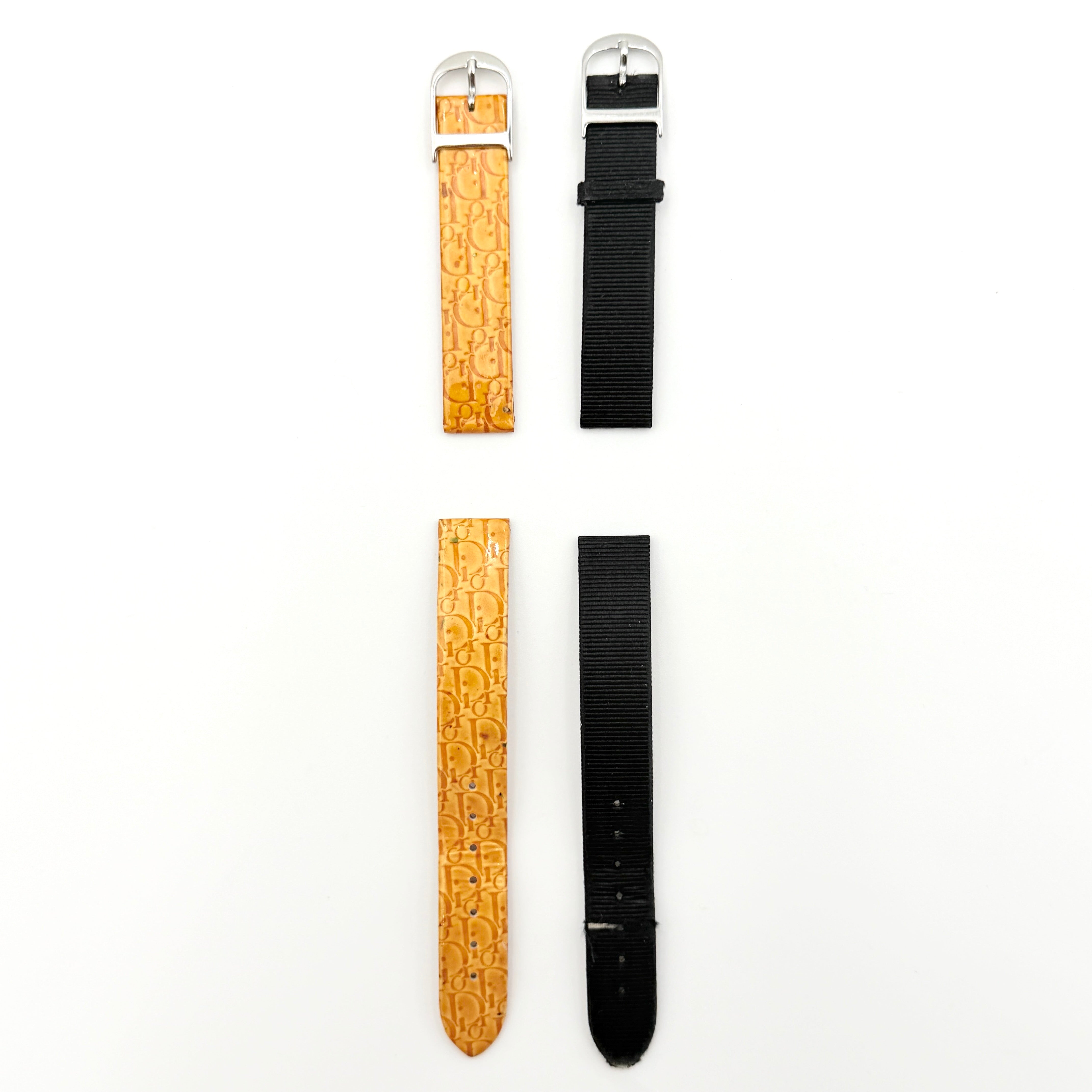 Dior Trotter Malice Watch with blue monogram strap and extra interchangeable yellow and black straps displayed.