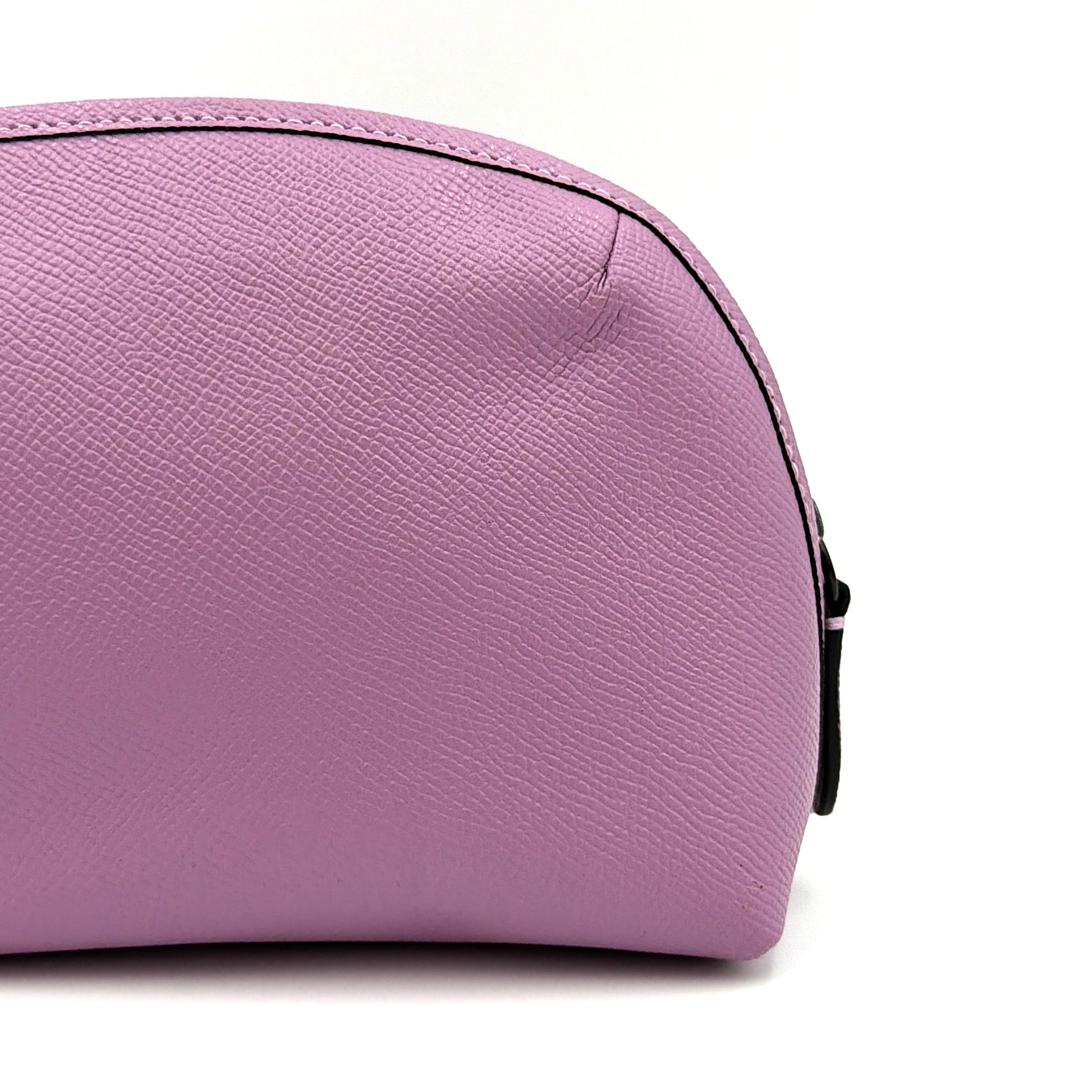 Coach Julienne Cosmetic Case 17 in purple grained leather with black hardware, photographed on a plain background.