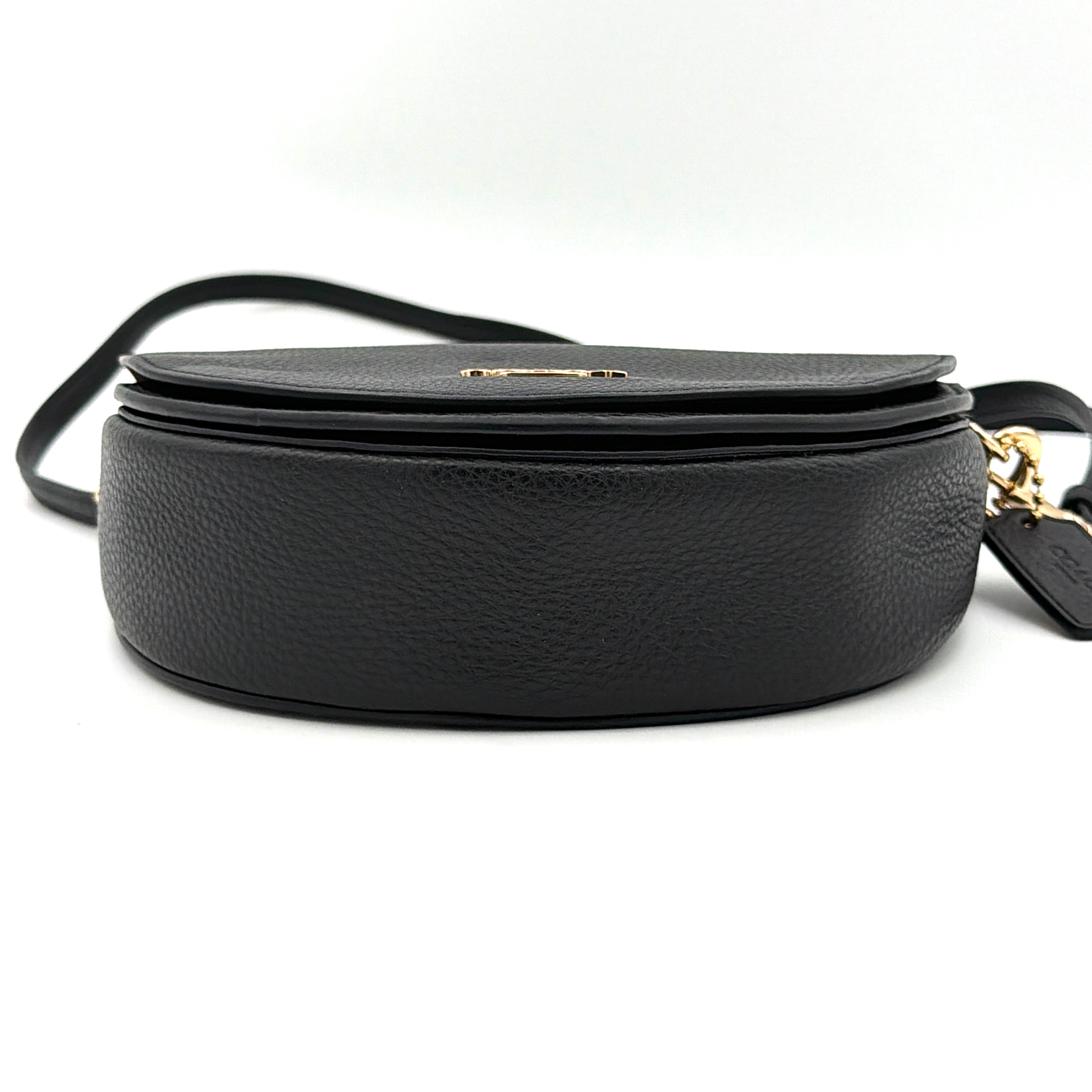 Coach Ellen Crossbody Bag in black pebbled leather with a half-moon silhouette, gold-tone hardware, and adjustable strap.