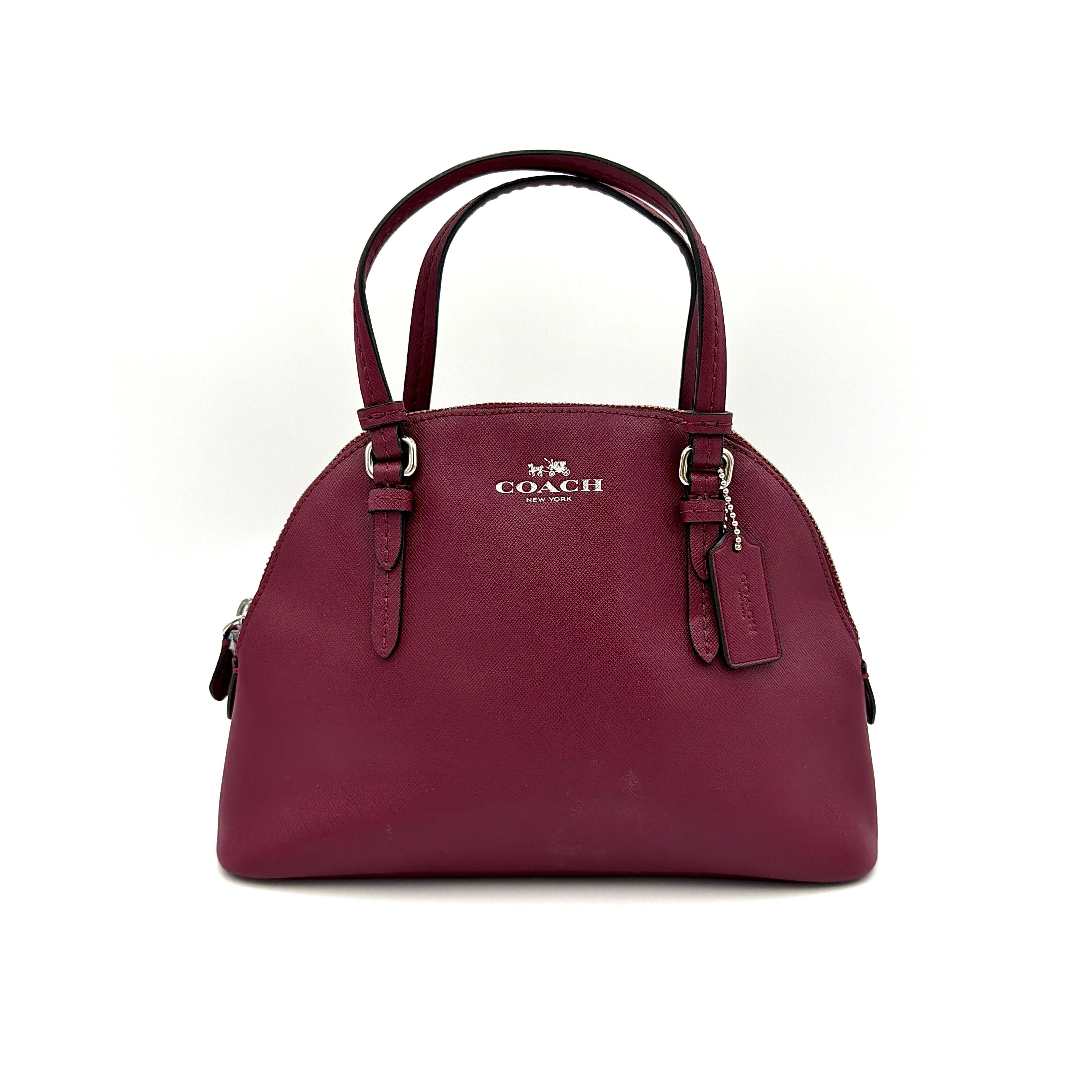 Coach Peyton satchel in burgundy crossgrain leather with silver hardware, shown with its detachable shoulder strap.