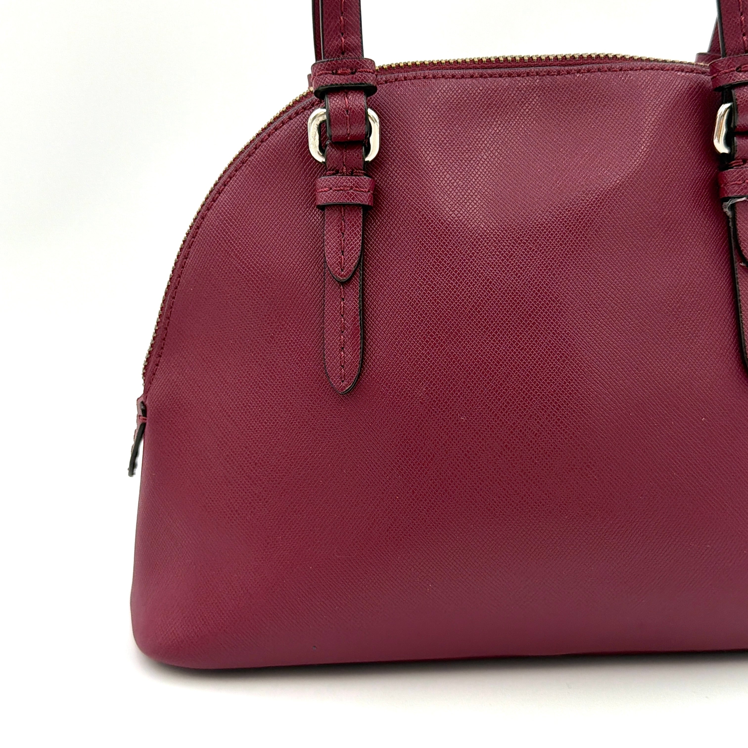 Coach Peyton satchel in burgundy crossgrain leather with silver hardware, shown with its detachable shoulder strap.