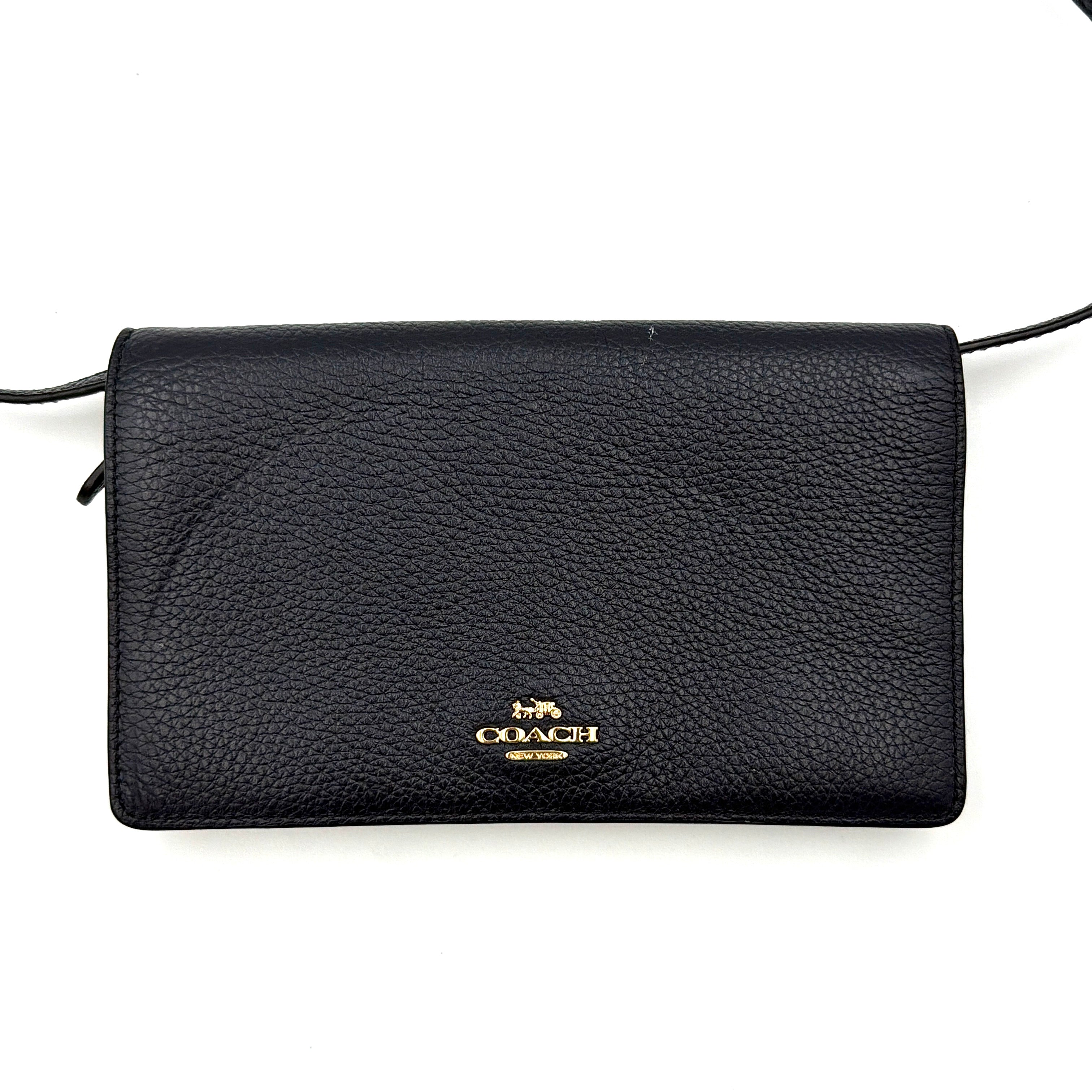 Coach Anna Foldover Clutch Crossbody Bag in navy pebbled leather with slim strap and gold logo detailing.