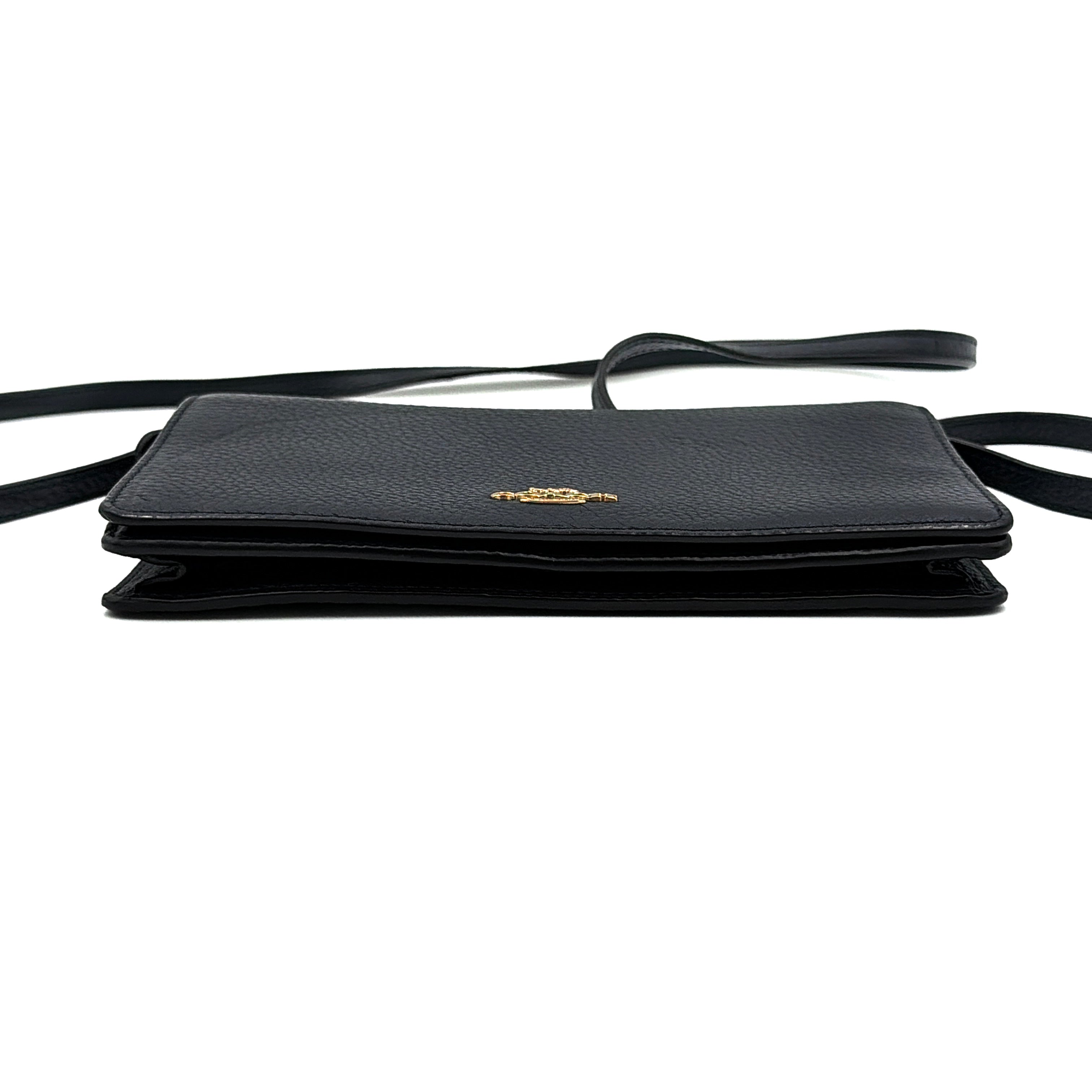 Coach Anna Foldover Clutch Crossbody Bag in navy pebbled leather with slim strap and gold logo detailing.