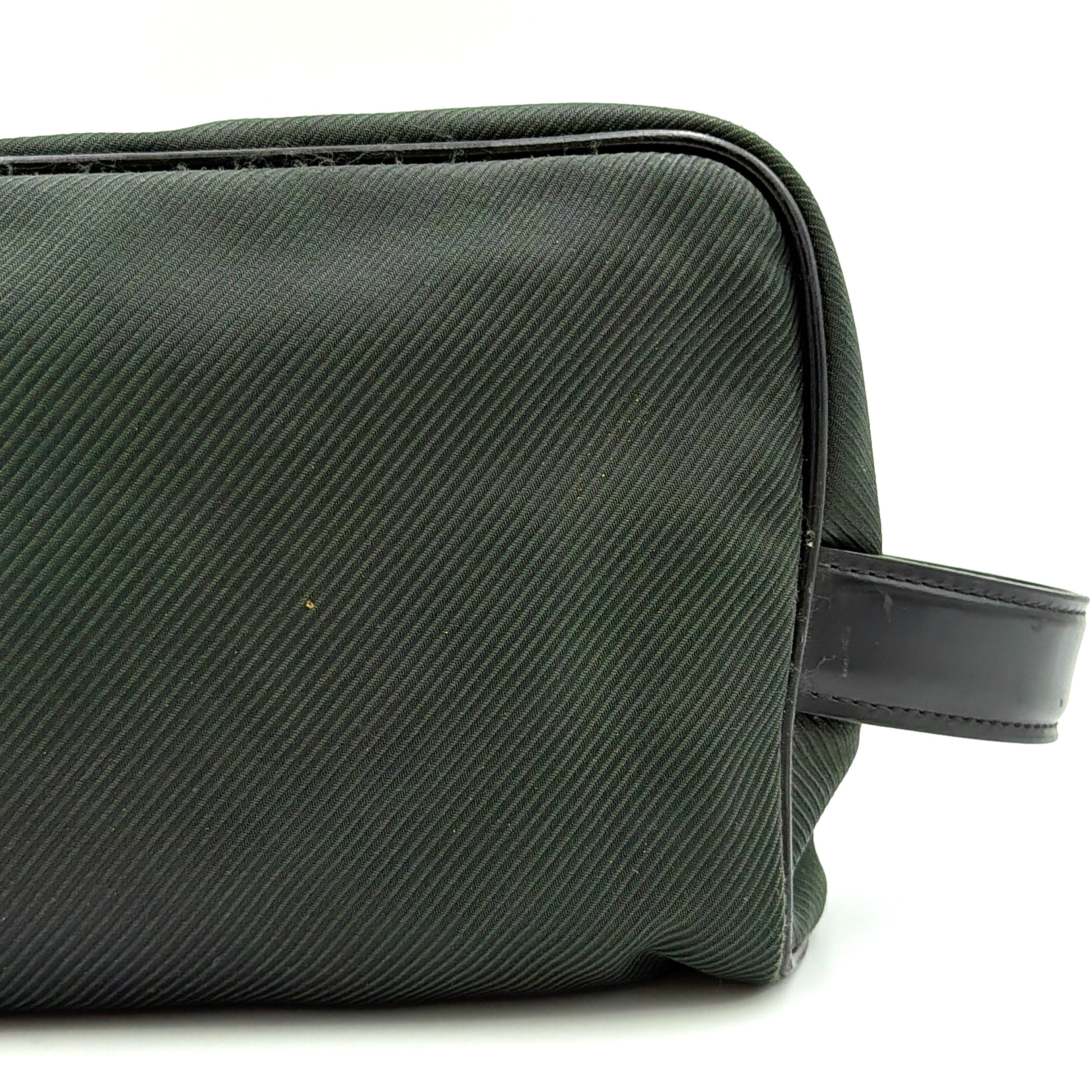 Louis Vuitton Taiga Parana Clutch Bag in deep green Taiga leather with black leather handle and silver-tone zipper, shown from the front.