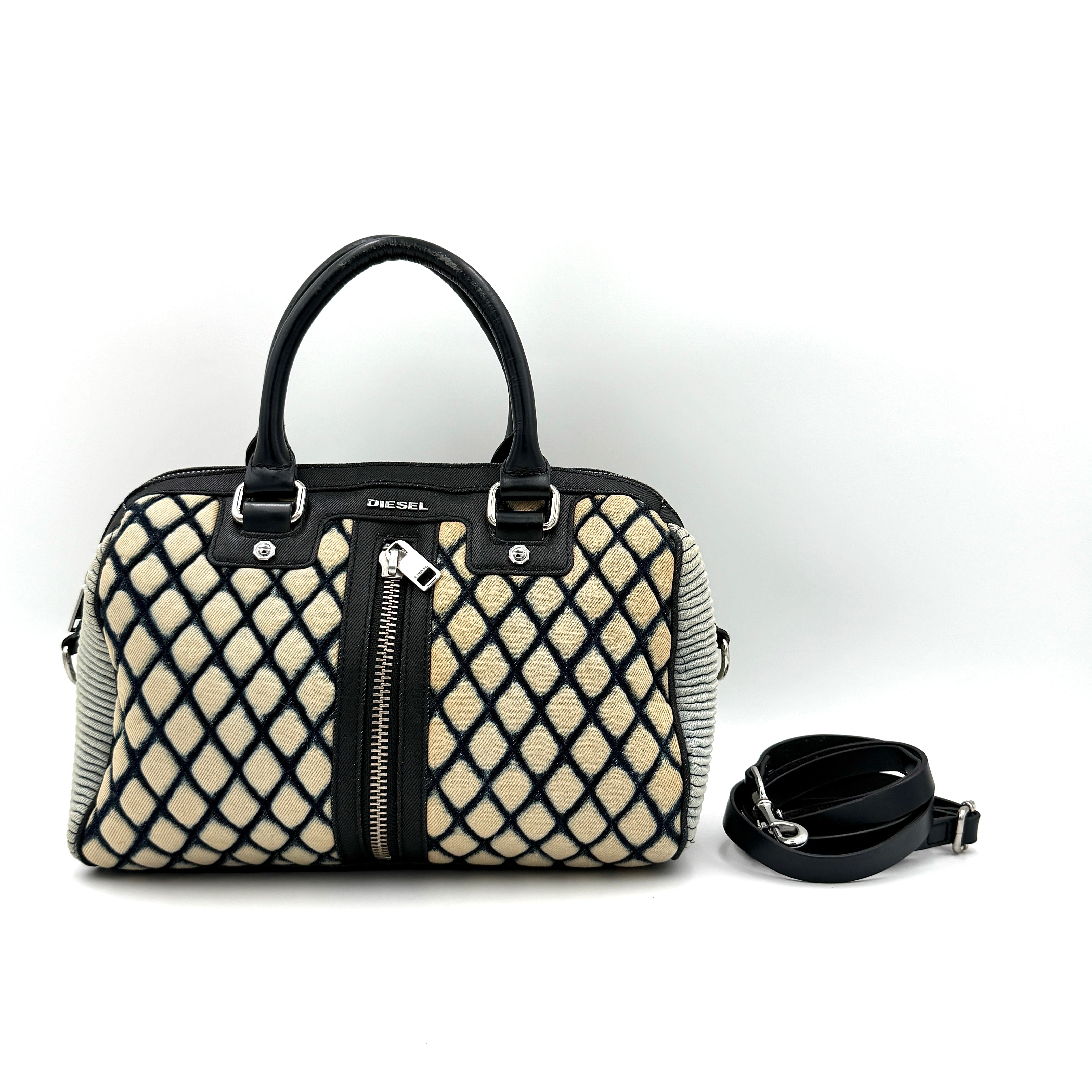 Diesel 2Way Boston Handbag in cream canvas with black velvet-effect lattice, dual leather handles, and detachable strap displayed in front.