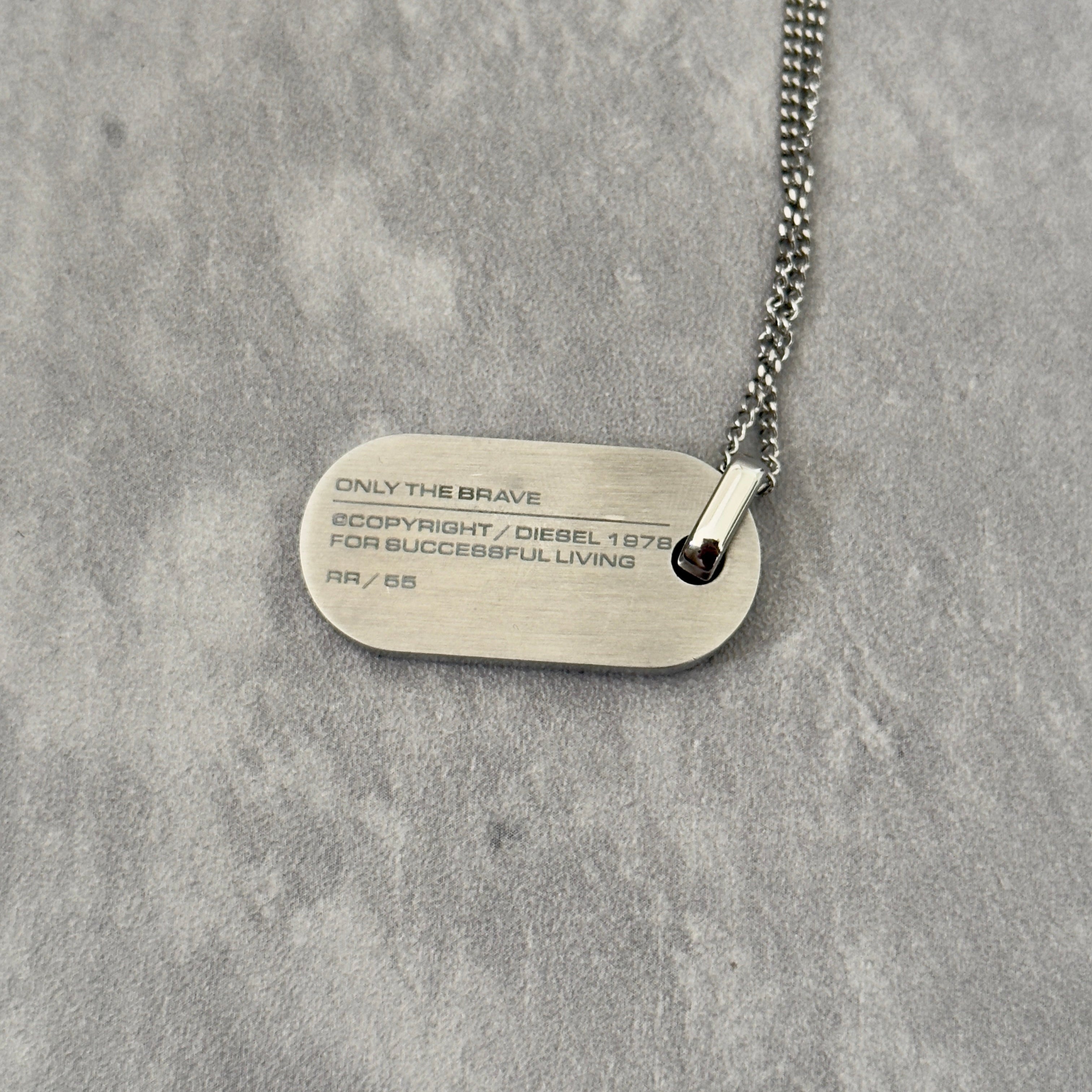 Diesel Signature 'For Successful Living' Dog Tag Necklace in stainless steel, featuring a brushed metal pendant and fine box chain.