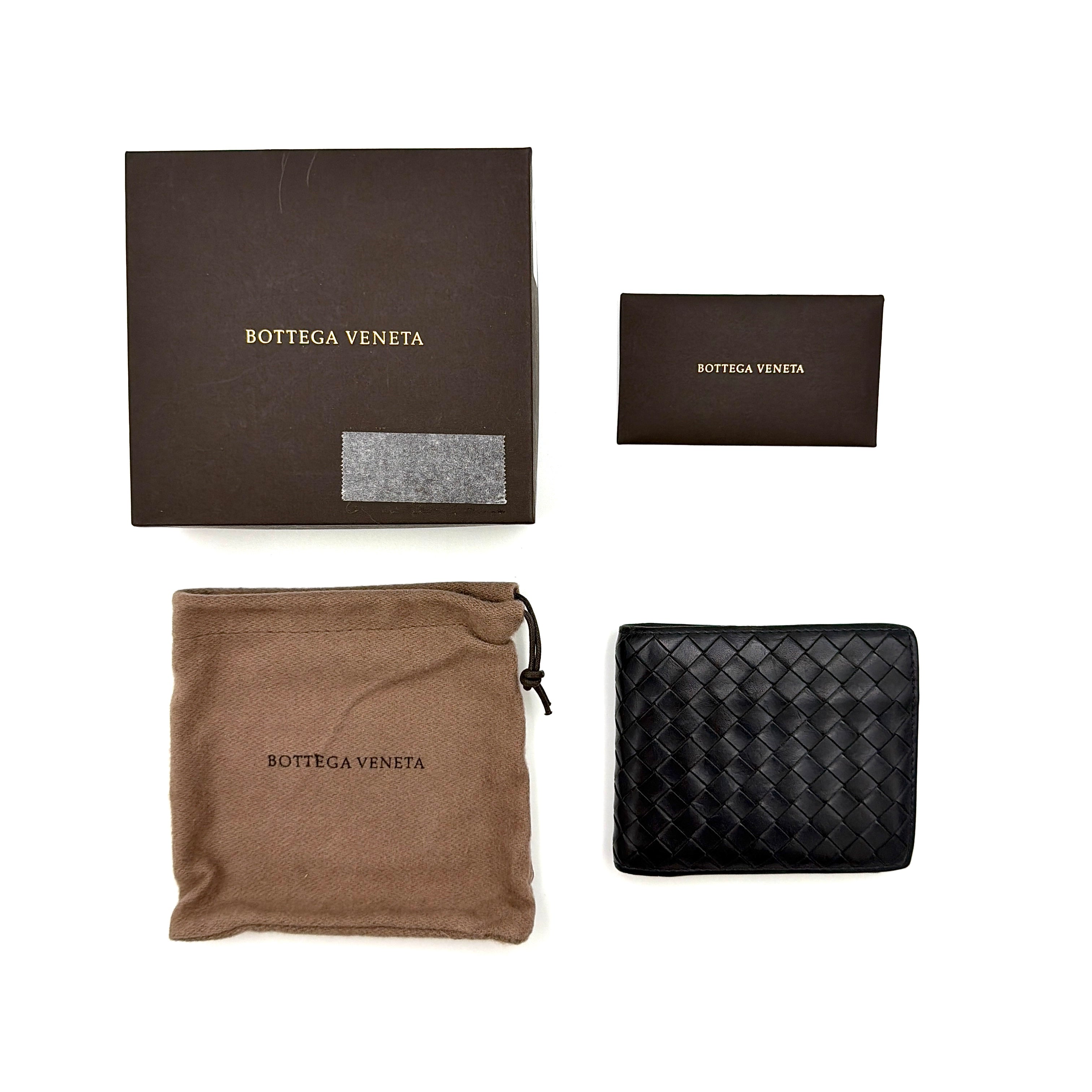 Black Bottega Veneta Intrecciato leather wallet with signature woven pattern photographed against a clean background.