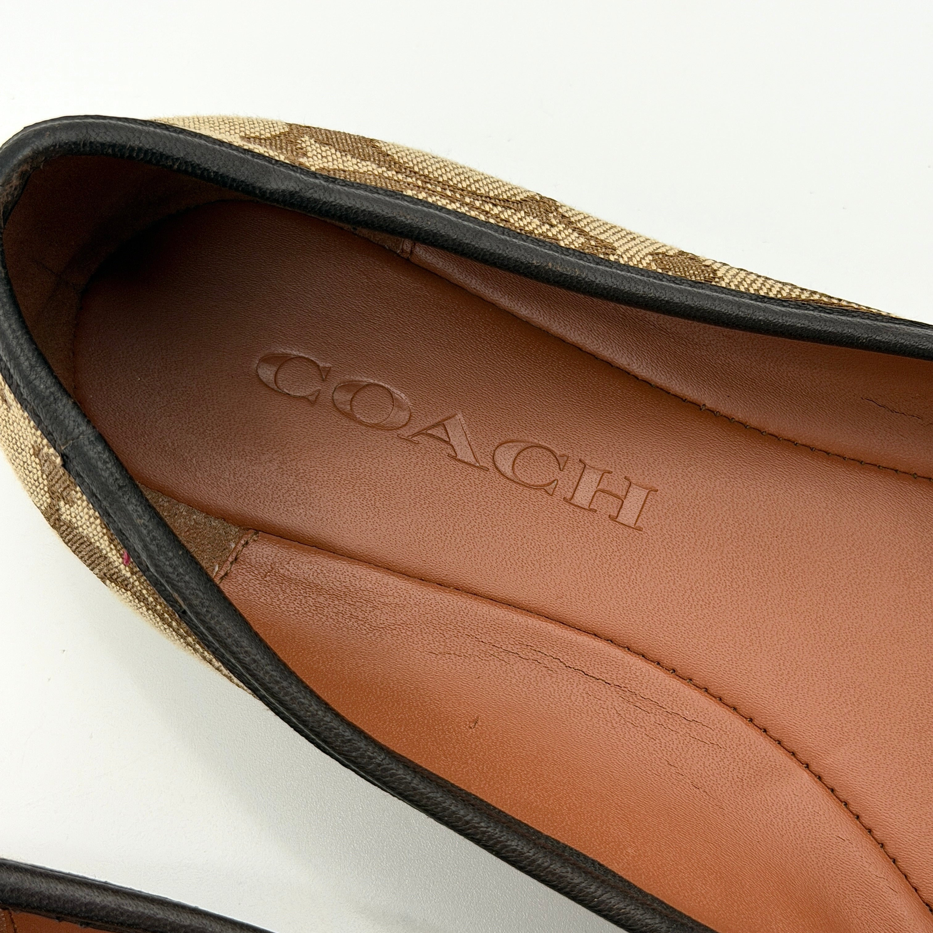 Coach Signature Bennie Jacqueline ballet flats in beige canvas with brown leather trims, shown side by side with tassel and gold charm details.