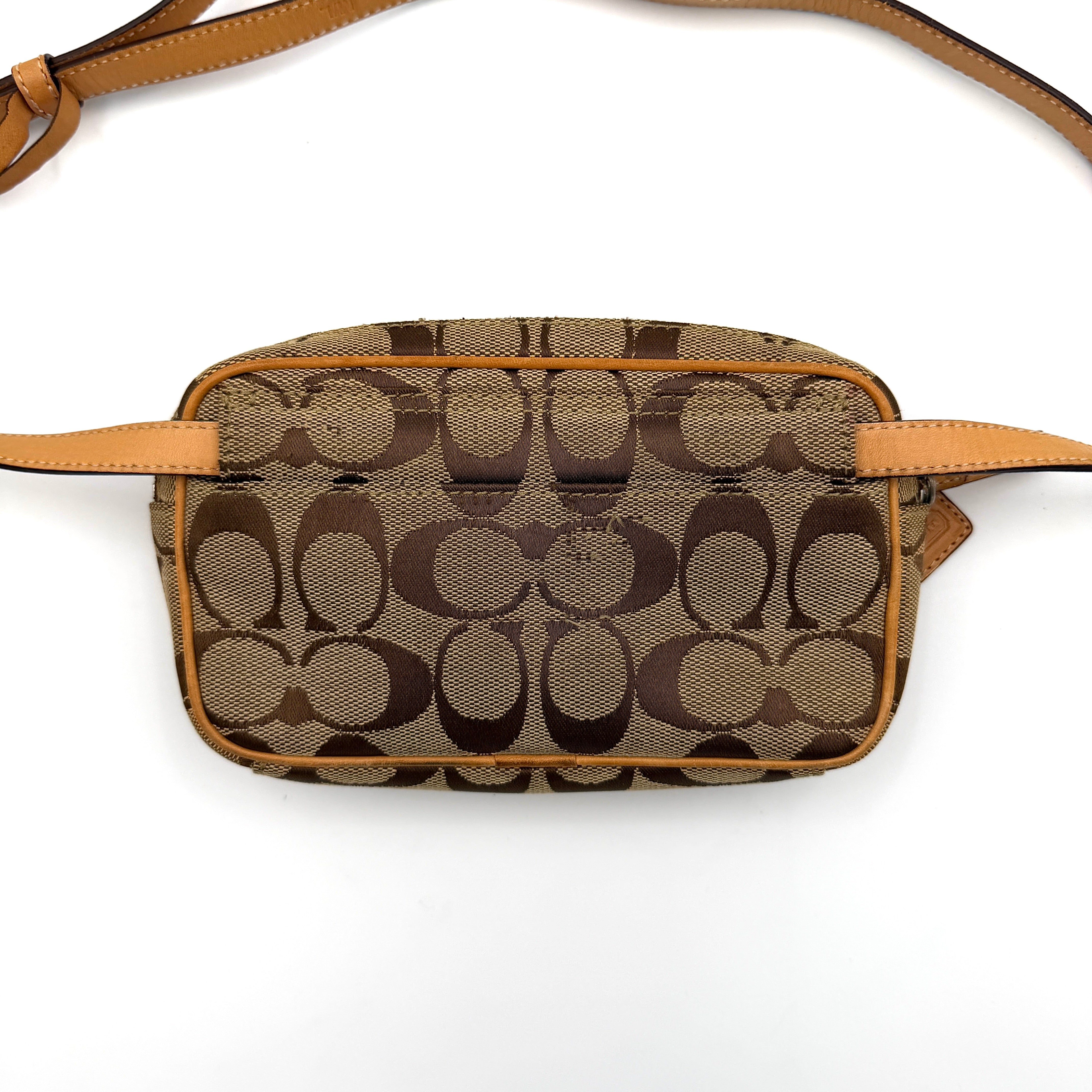 Coach Signature Canvas crossbody bag in beige and tan with iconic 'C' motif, natural leather trim and adjustable strap.