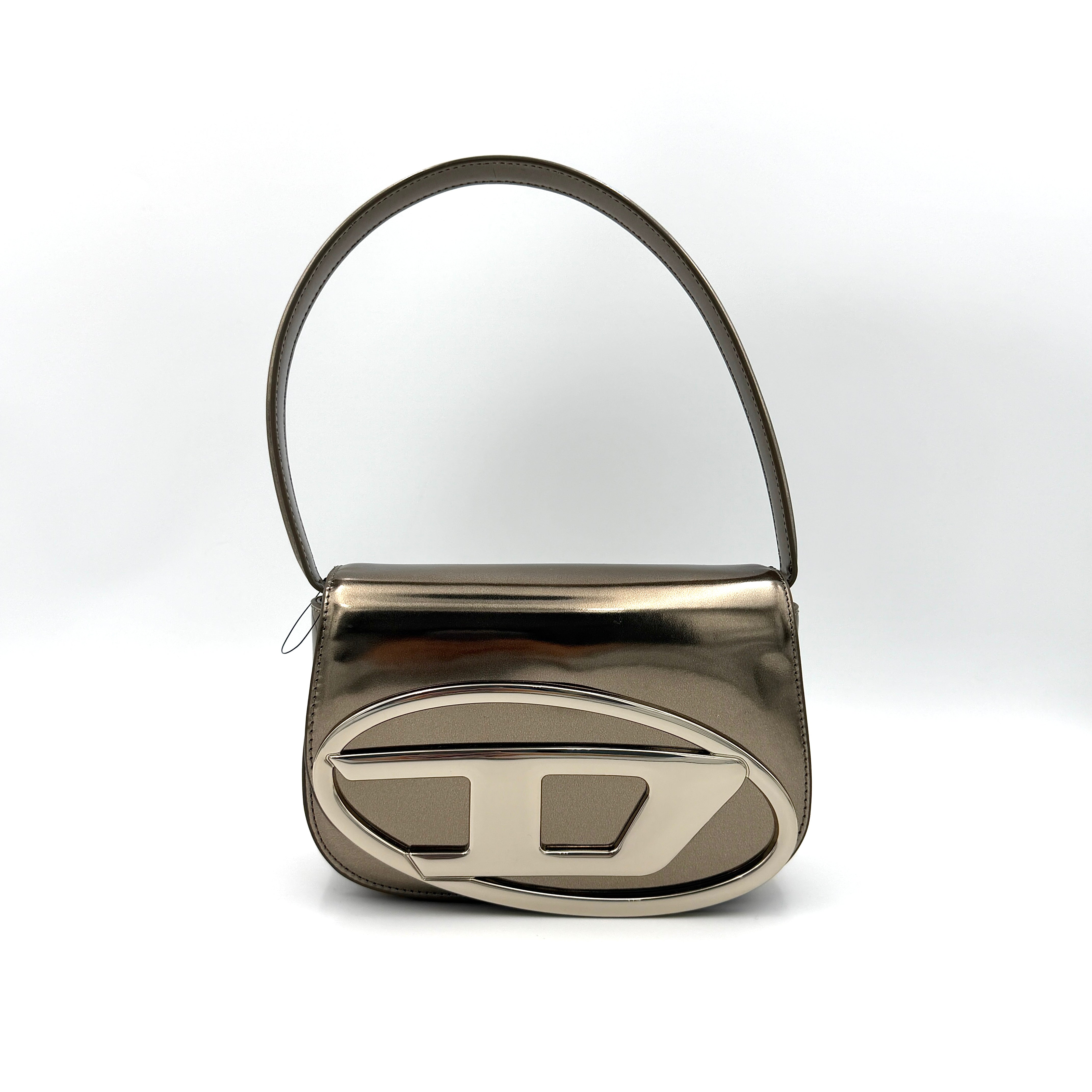 Diesel 1DR metallic silver shoulder bag with oversized chrome D-logo plaque, top handle, and detachable strap displayed against a white background.