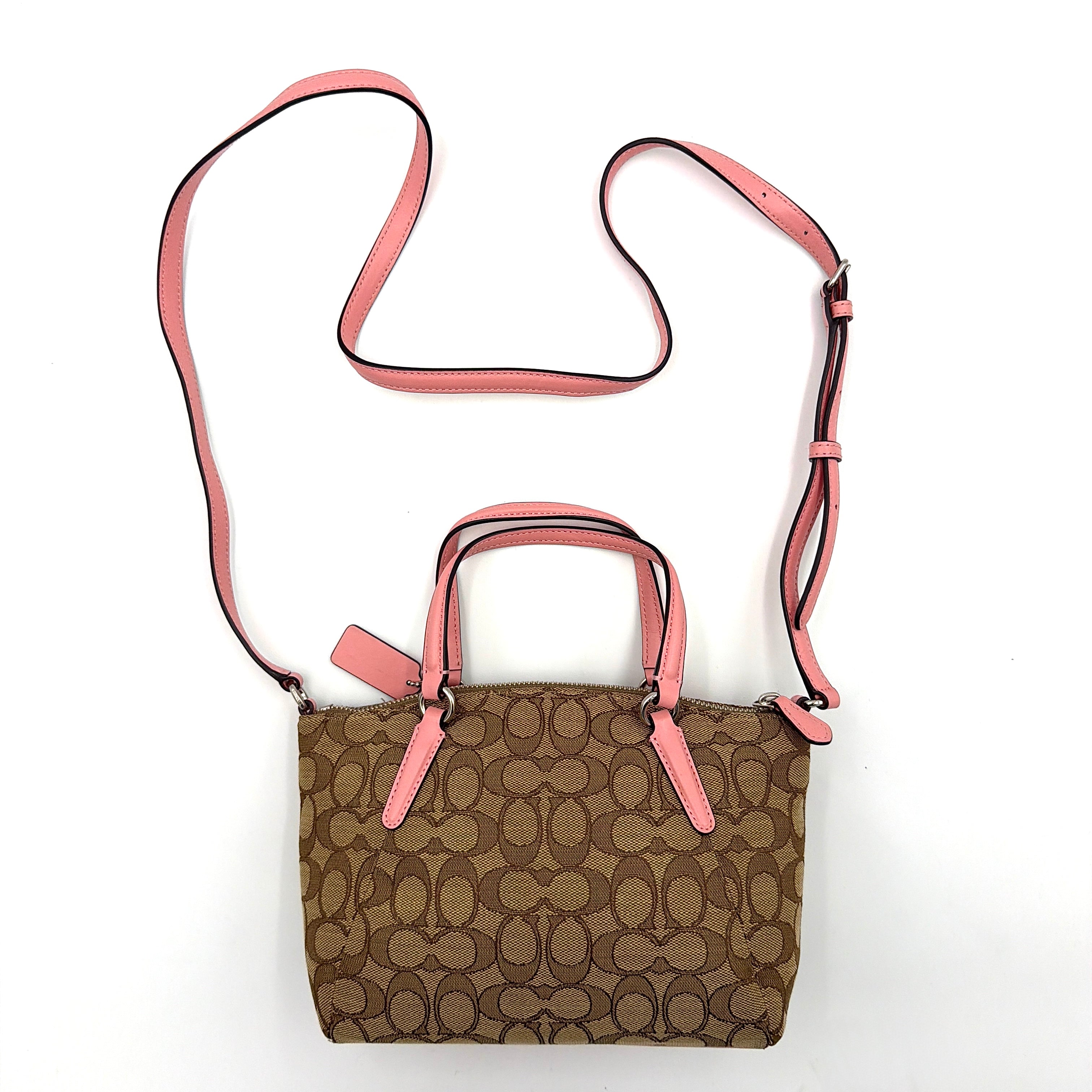 Coach 2Way Kelsey Shoulder Bag with beige monogram canvas and pink leather accents, shown with adjustable shoulder strap.