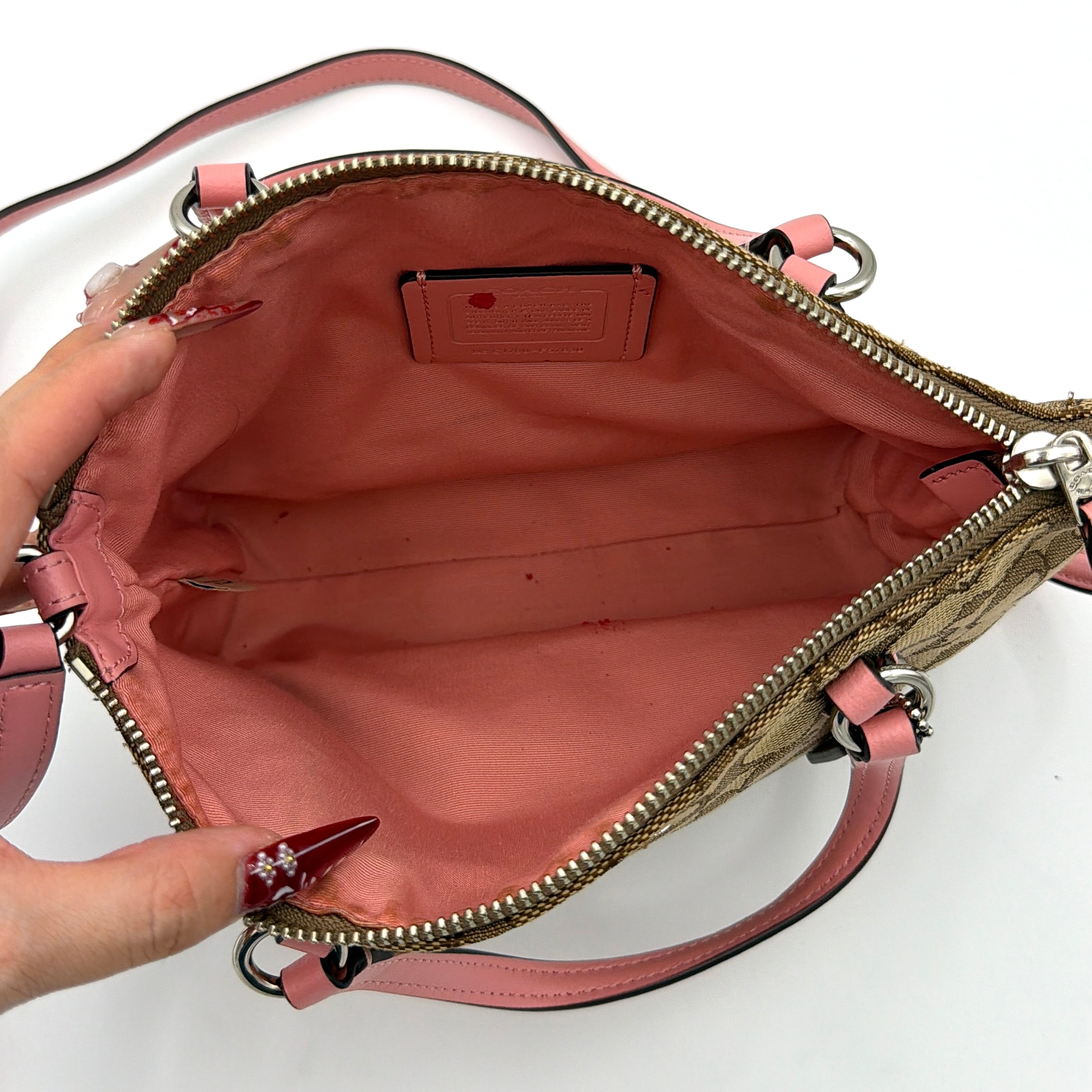 Coach 2Way Kelsey Shoulder Bag with beige monogram canvas and pink leather accents, shown with adjustable shoulder strap.