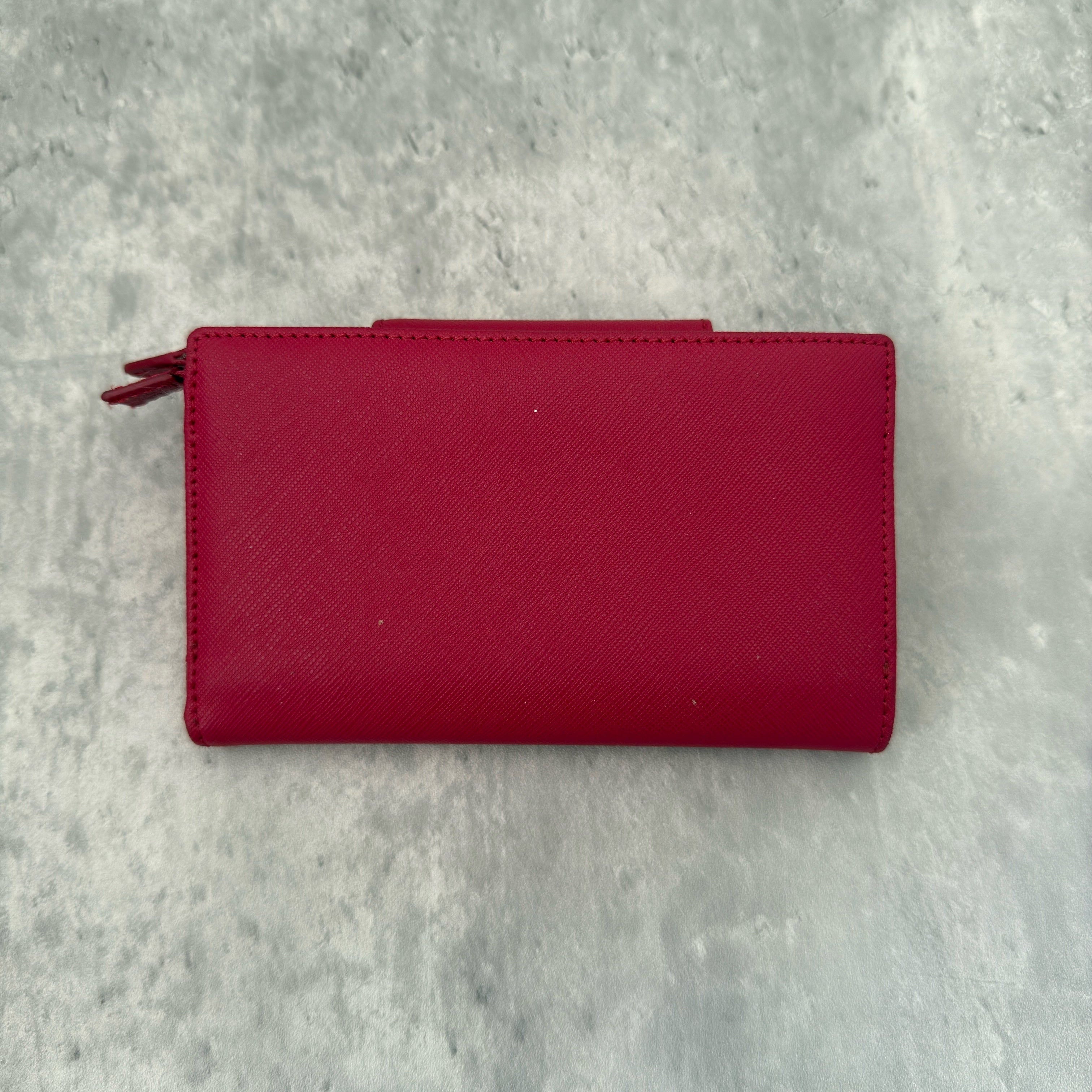 Vivienne Westwood Logo Orb Clip Wallet in Rose Pink Saffiano Leather with silver-tone emblem, card slots, and zippered coin pouch.