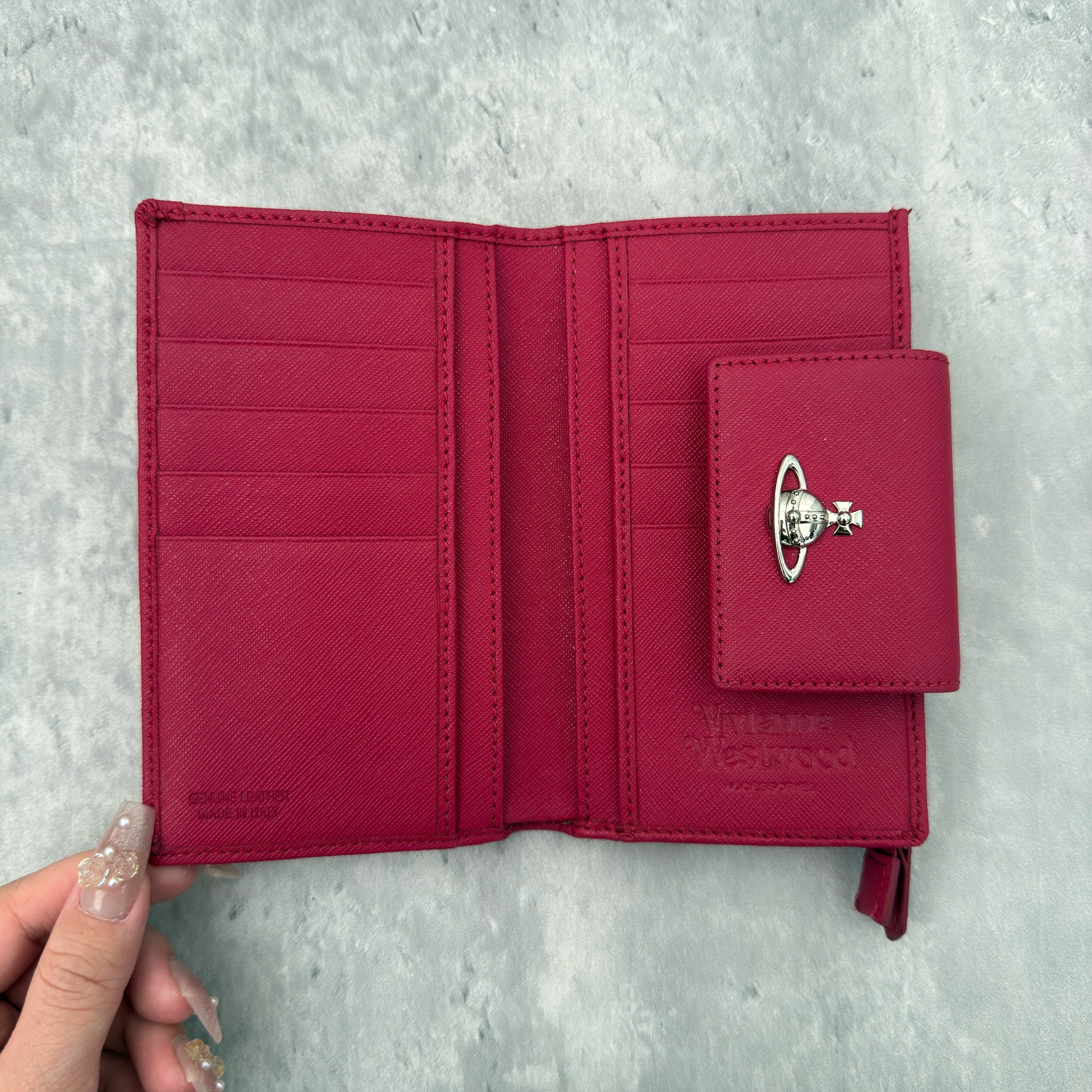 Vivienne Westwood Logo Orb Clip Wallet in Rose Pink Saffiano Leather with silver-tone emblem, card slots, and zippered coin pouch.