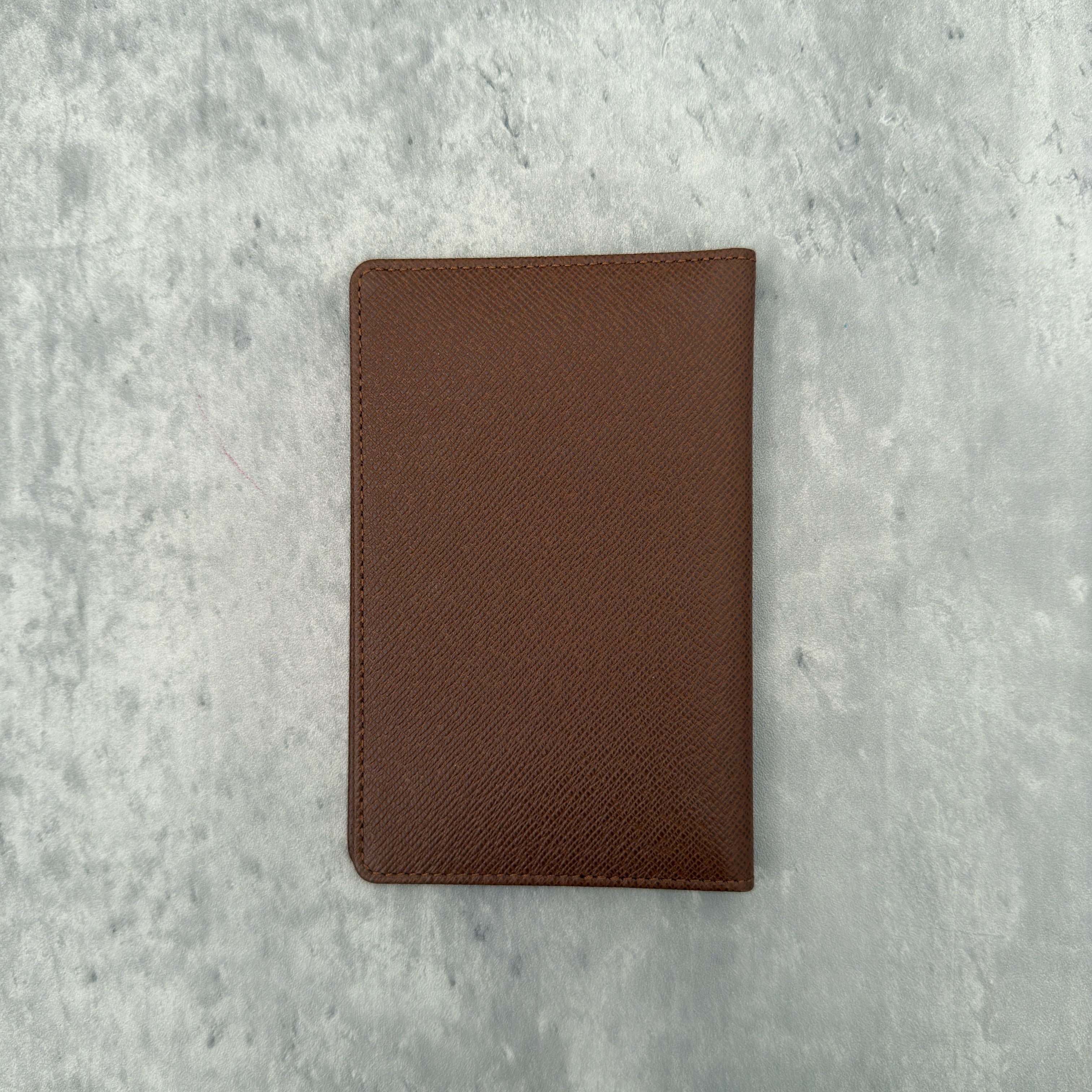Louis Vuitton Vintage Brown Leather Cardholder with embossed LV logo and multiple card slots.