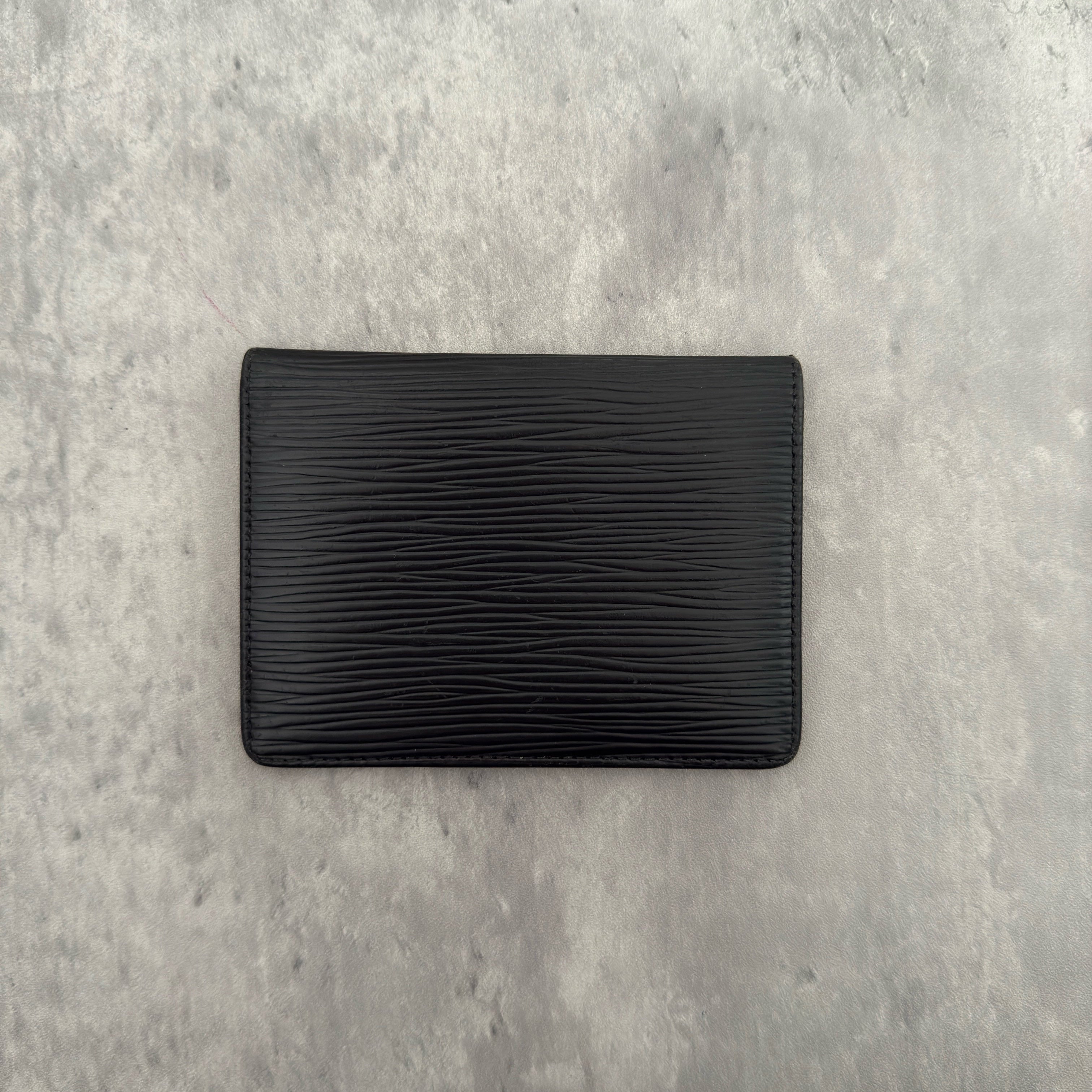 Louis Vuitton Epi Black Cardholder in black Epi leather, featuring dual transparent card slots and a slim, elegant design.