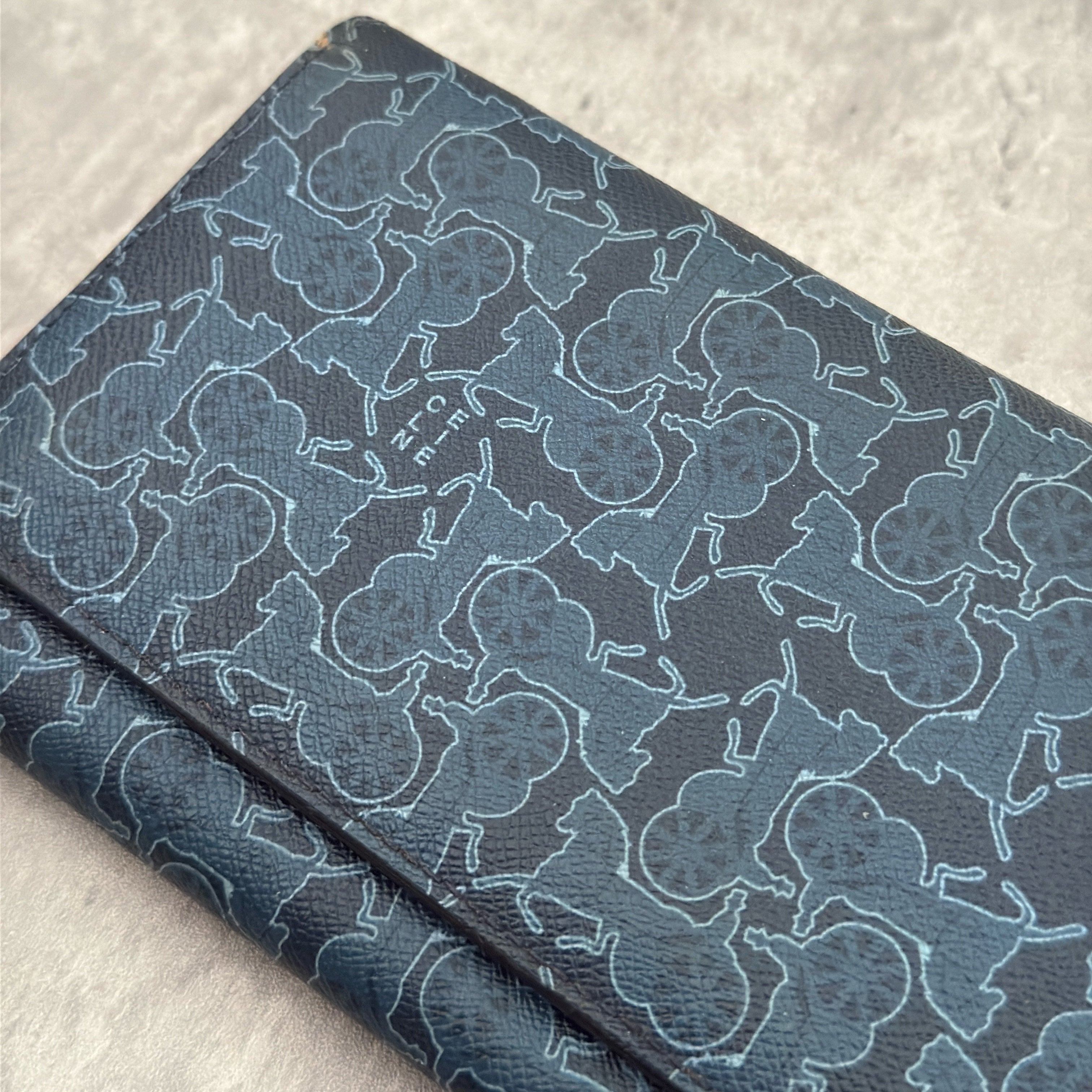 Celine Macadam Carriage Navy Blue Long Wallet featuring signature carriage monogram canvas, blue leather interior, and multiple compartments for organization.