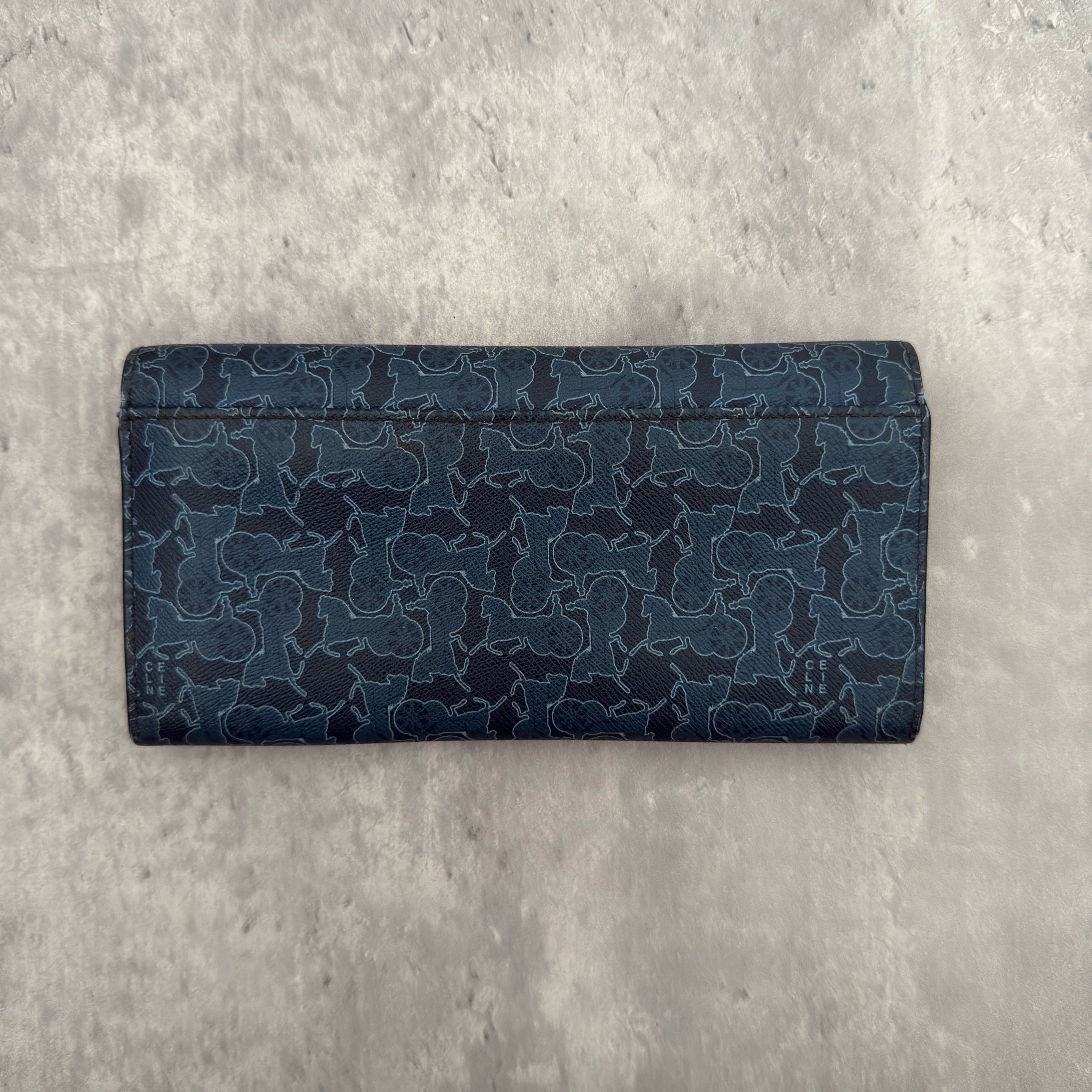 Celine Macadam Carriage Navy Blue Long Wallet featuring signature carriage monogram canvas, blue leather interior, and multiple compartments for organization.