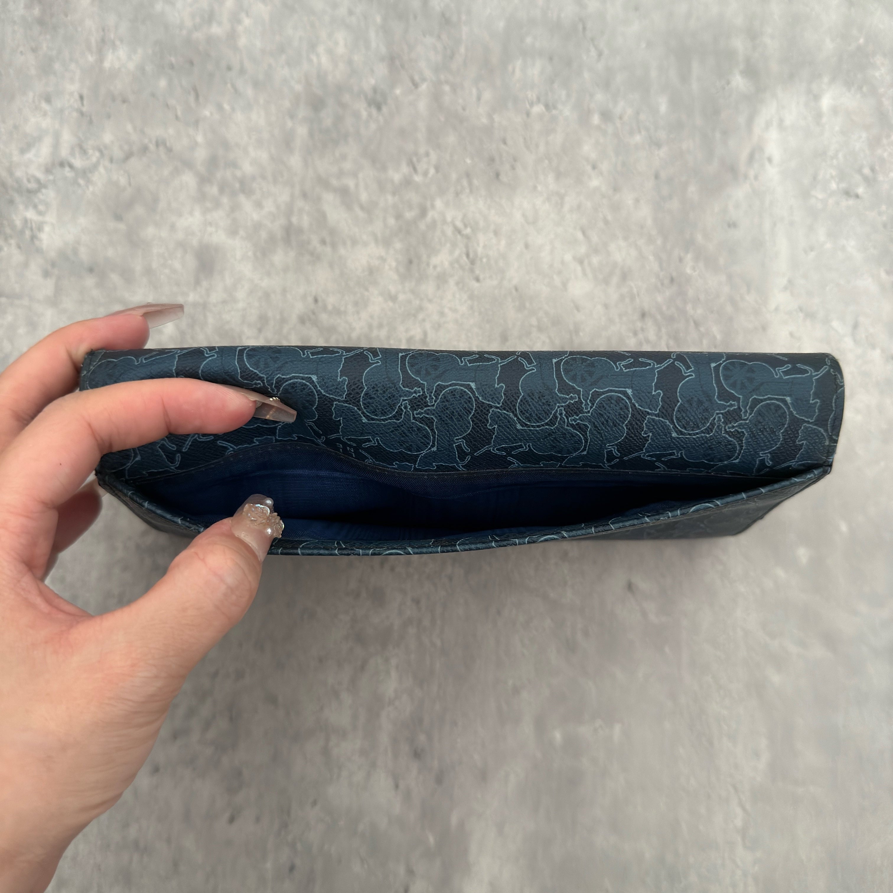 Celine Macadam Carriage Navy Blue Long Wallet featuring signature carriage monogram canvas, blue leather interior, and multiple compartments for organization.