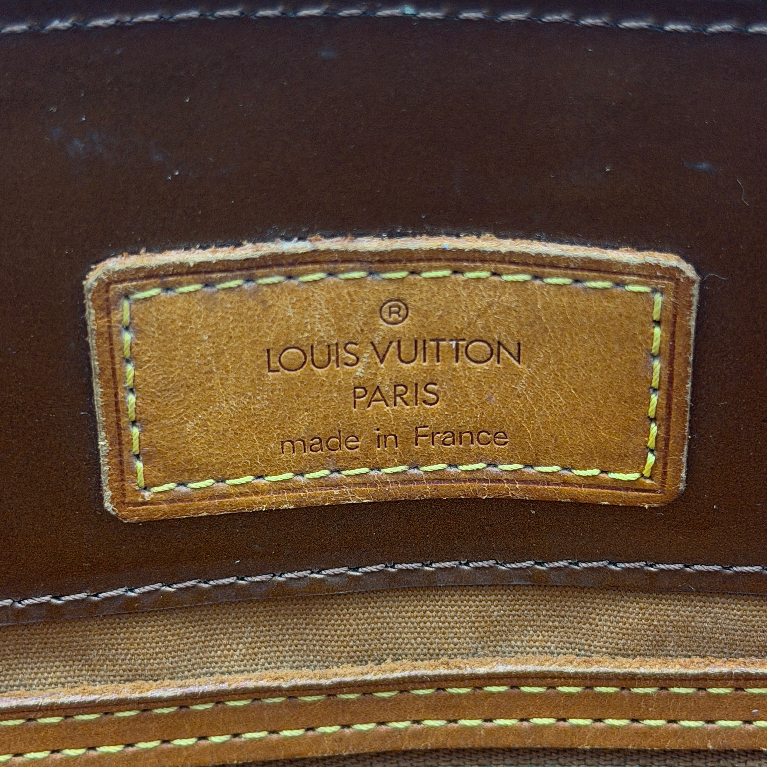Louis Vuitton PM Vernis Reade Shoulder Bag in glossy bronze patent leather with monogram embossing and structured silhouette.