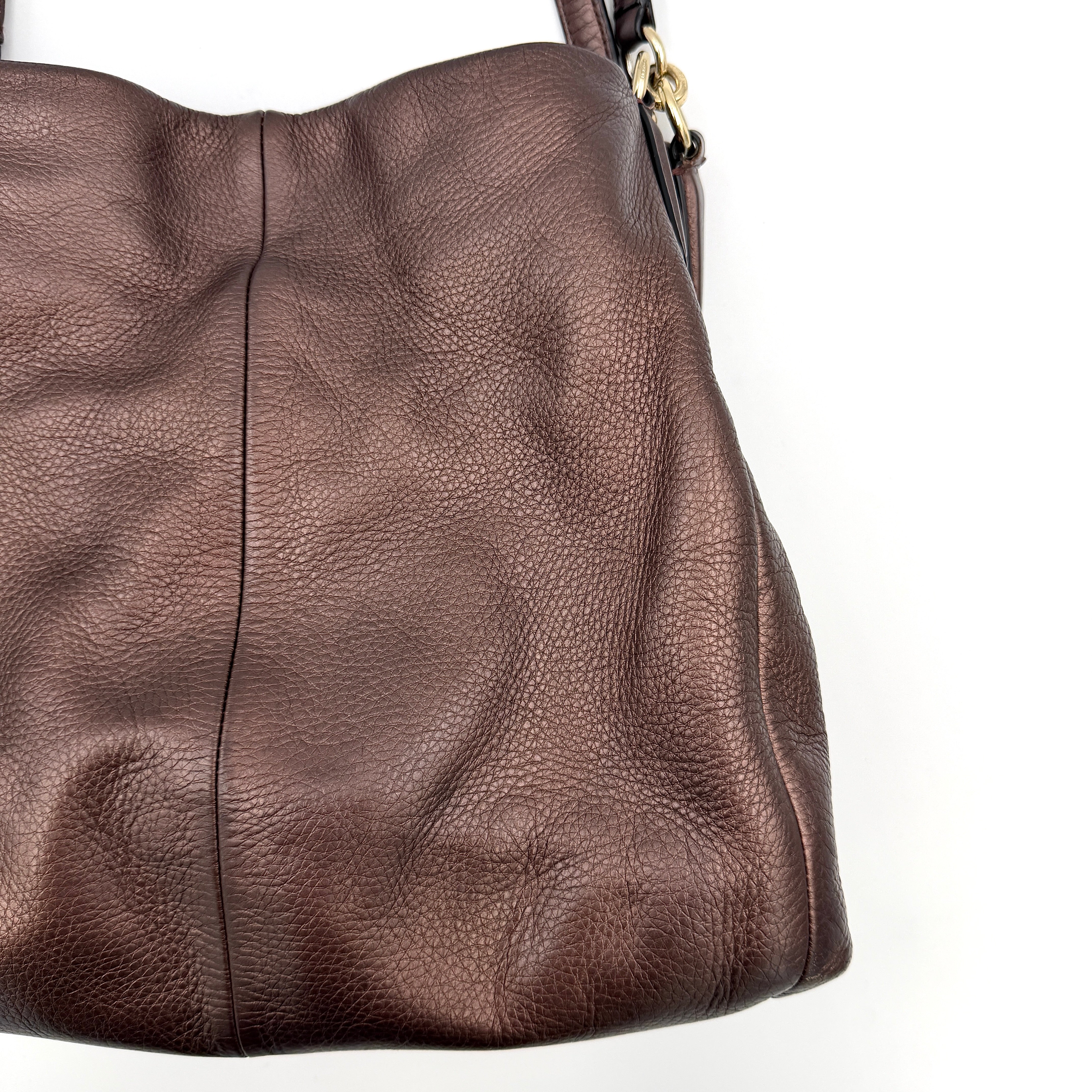 Coach Madison Phoebe Shoulder Bag in rich brown pebbled leather with double shoulder straps and gold-tone hardware, shown upright against a white backdrop.