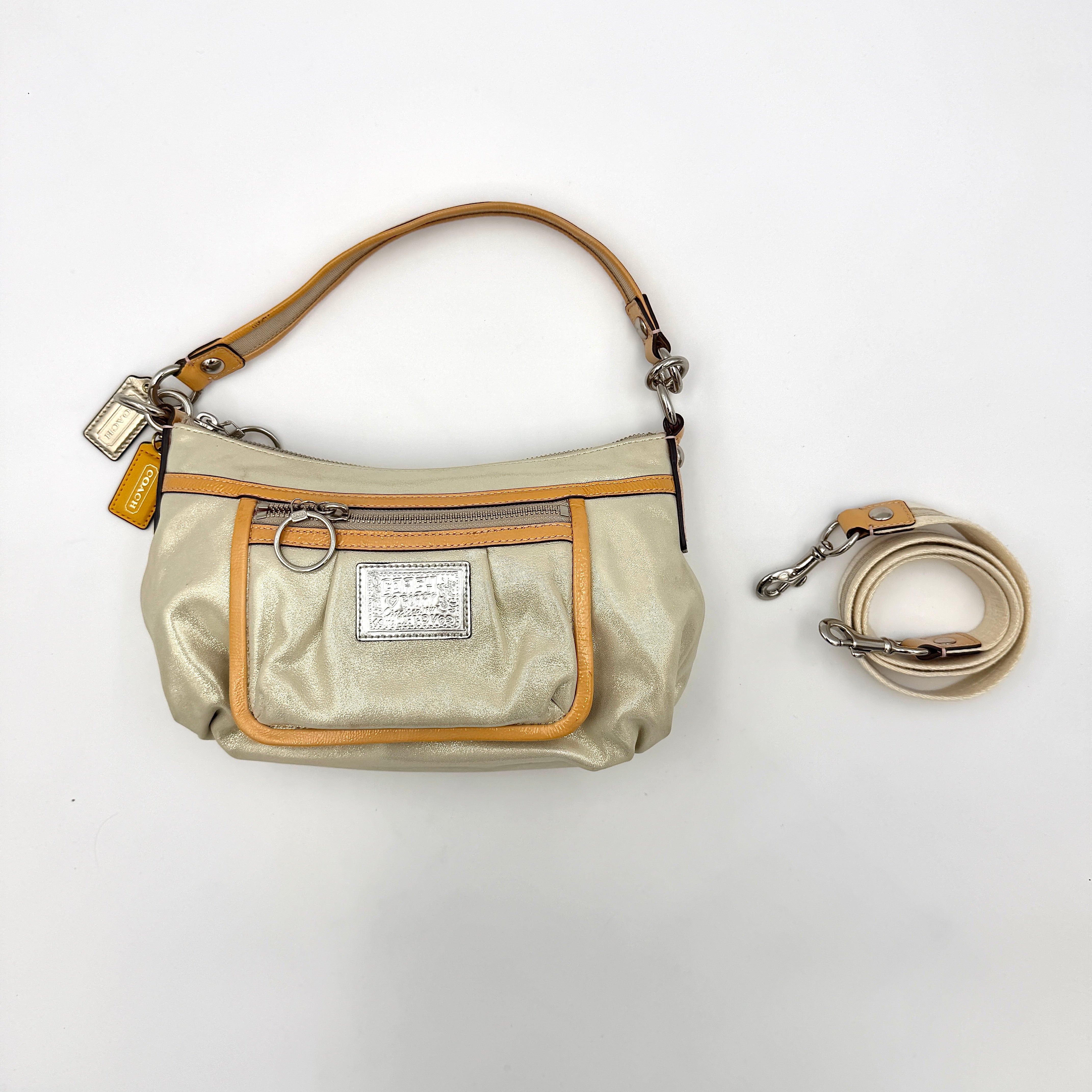 Coach Poppy Sparkle Groovy bag in cream with tan trim, metallic plaque, and detachable shoulder strap displayed alongside.