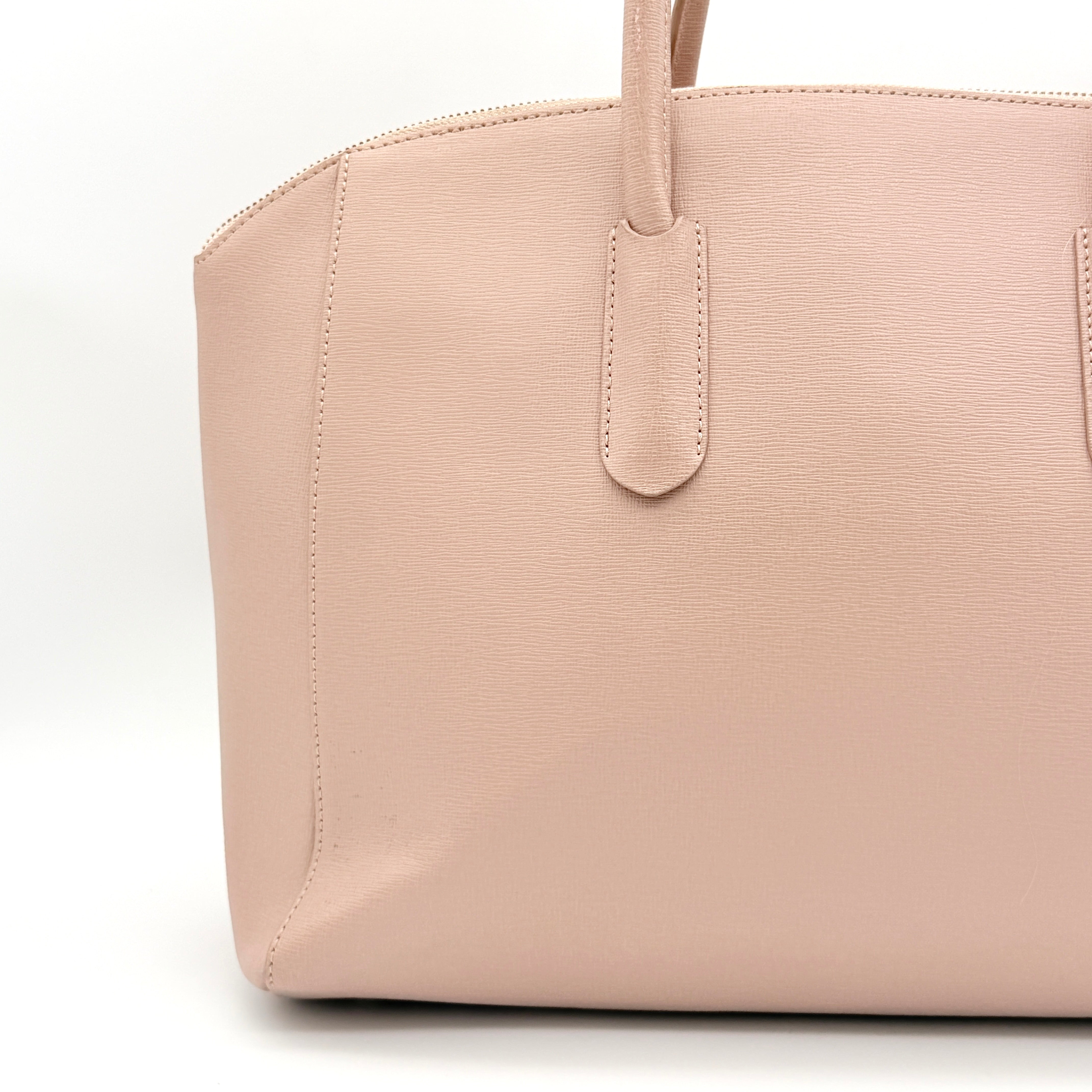Furla Tessa handbag in light pink leather with gold hardware and double top handles.
