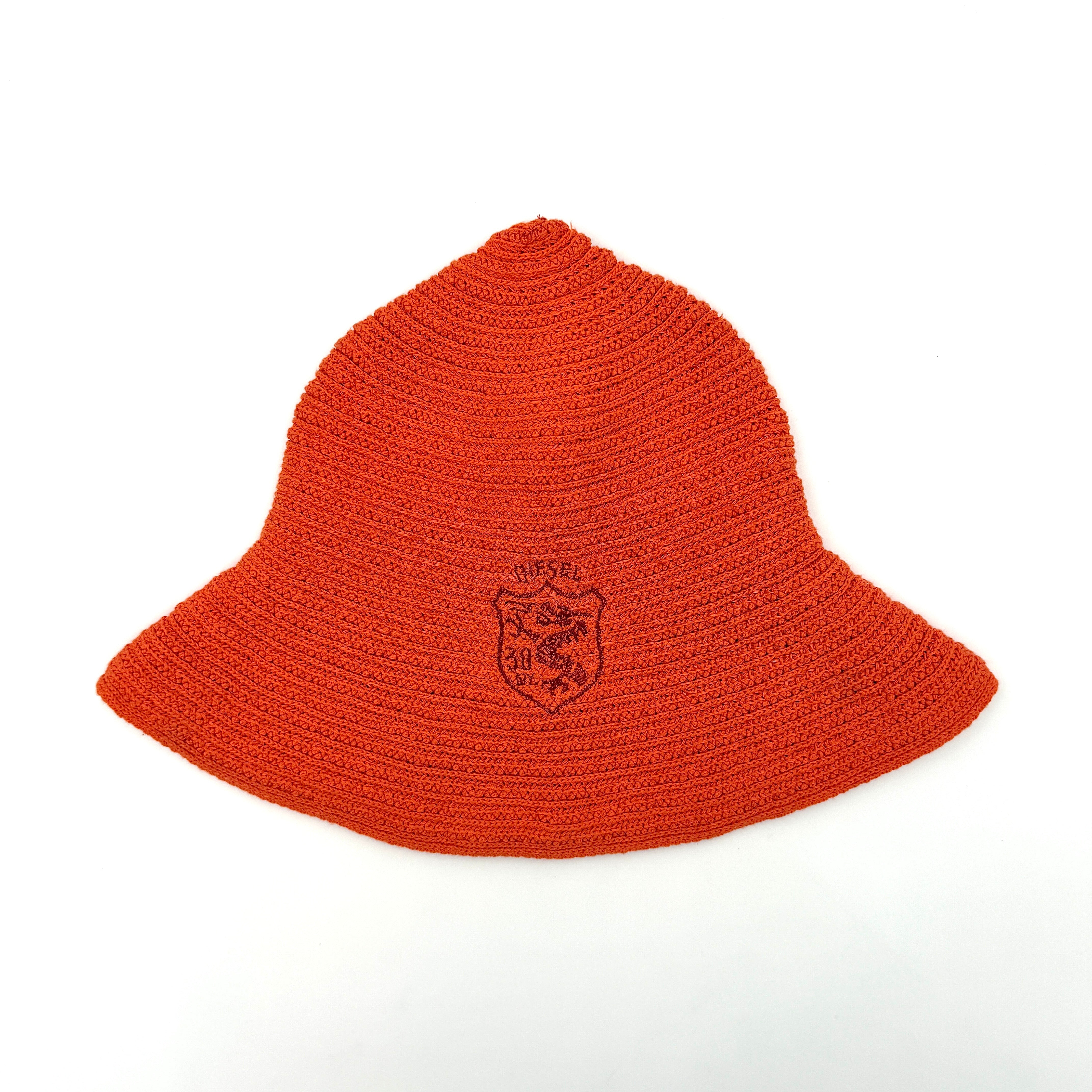 Vibrant orange Diesel crochet bucket hat with a wide brim and signature embroidered crest, displayed against a neutral background.